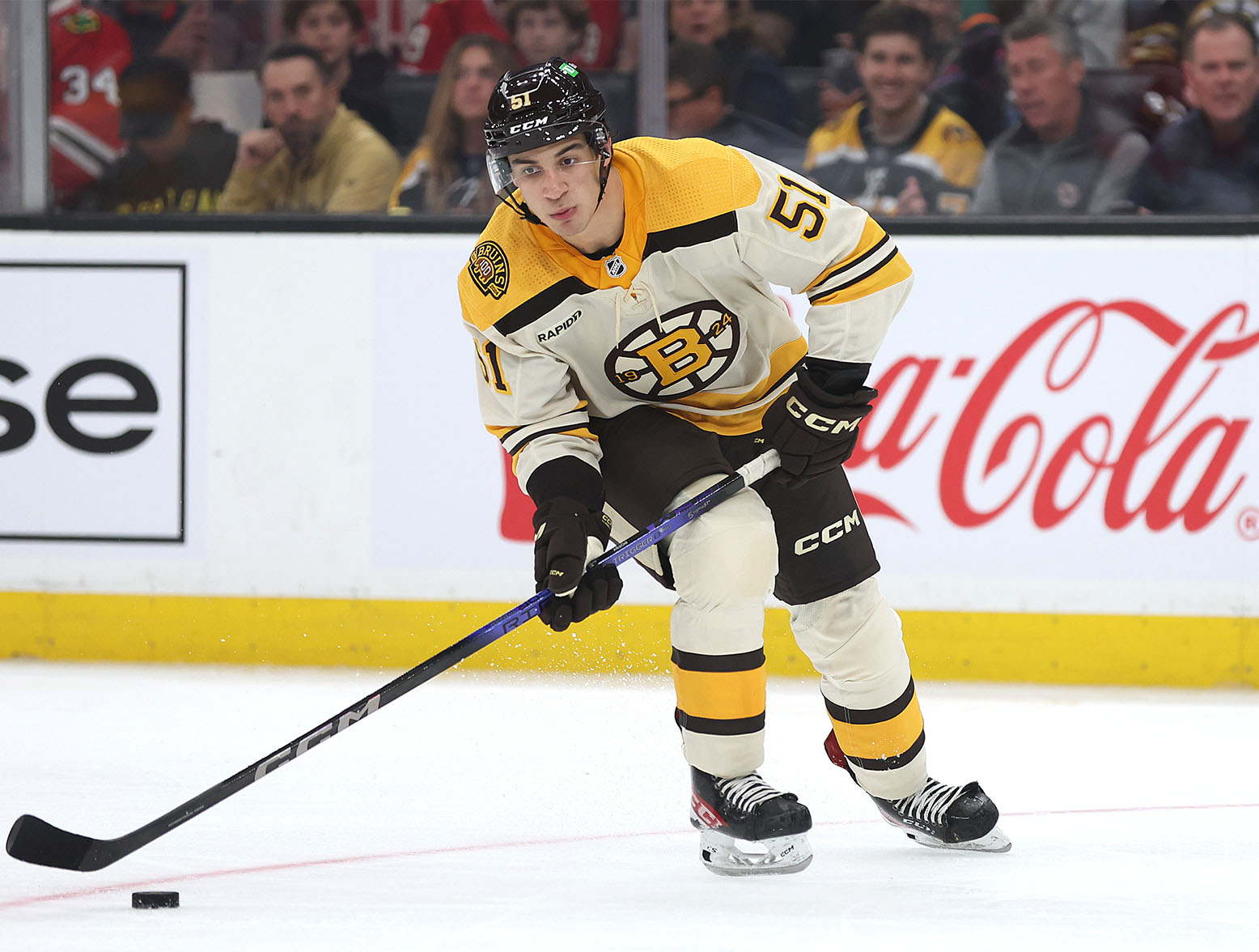 BOSTON, MASSACHUSETTS - OCTOBER 11: Matthew Poitras #51 of the Boston Bruins skates against the Chicago Blackhawks in his first NHL game during the third period of the Bruins home opener at TD Garden on October 11, 2023 in Boston, Massachusetts. The Bruins defeat the Blackhawks 3-1. (Photo by Maddie Meyer/Getty Images)