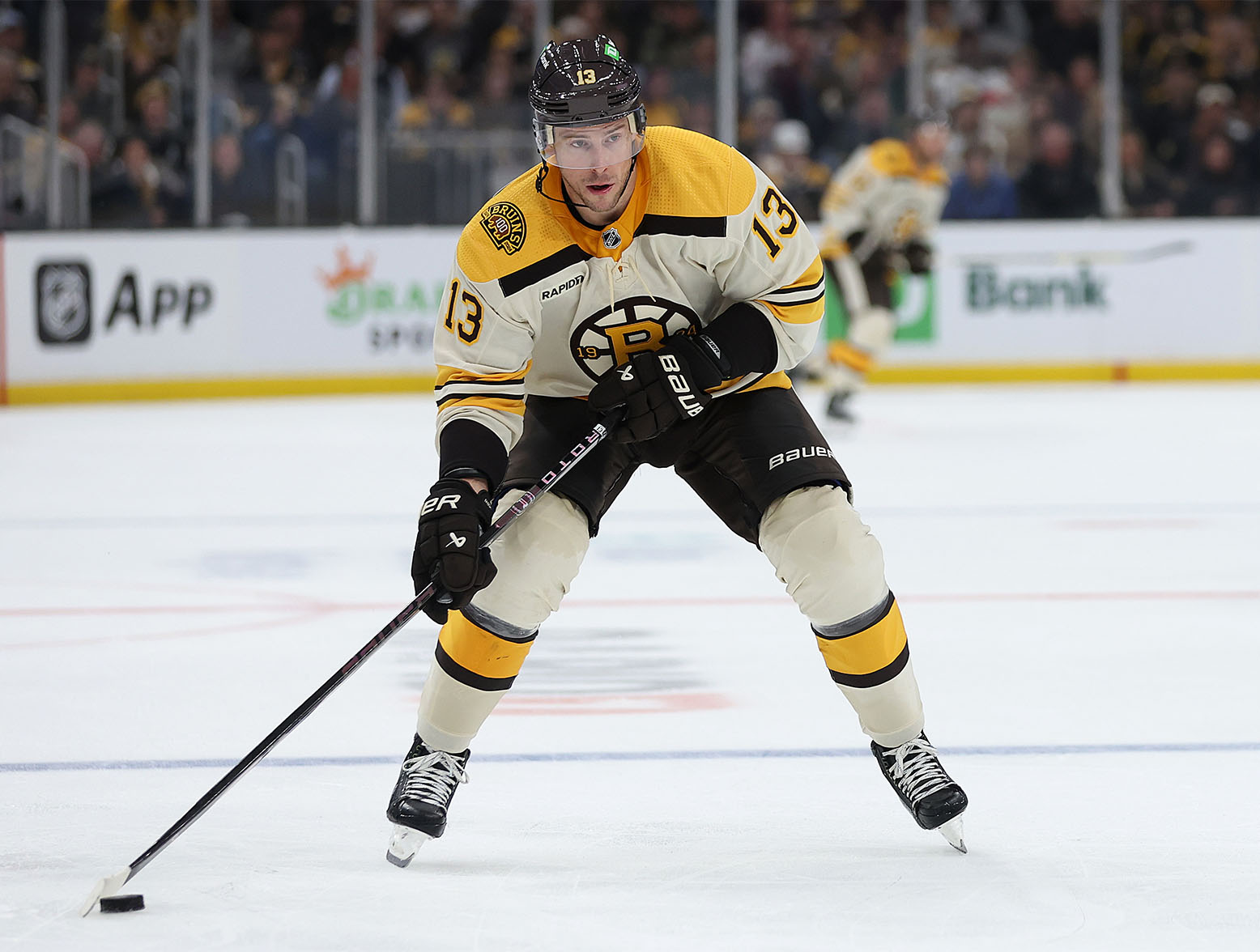 BOSTON, MASSACHUSETTS - OCTOBER 11: Charlie Coyle #13 of the Boston Bruins skates against the Chicago Blackhawks during the third period of the Bruins home opener at TD Garden on October 11, 2023 in Boston, Massachusetts. The Bruins defeat the Blackhawks 3-1.  (Photo by Maddie Meyer/Getty Images)