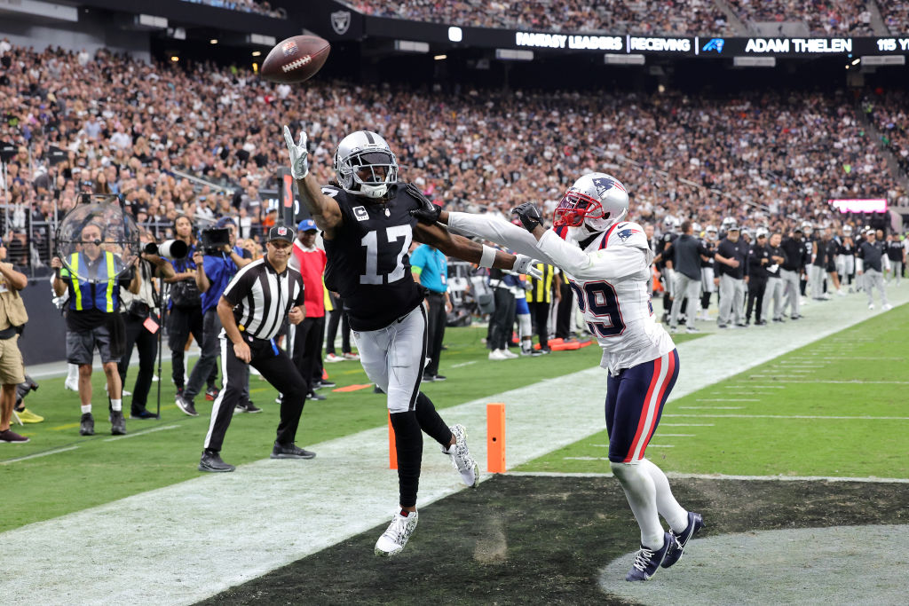 LAS VEGAS, NEVADA - OCTOBER 15: Davante Adams #17 of the Las Vegas Raiders attempts to catch a pass while defended by J.C. Jackson #29 of the New England Patriots during the fourth quarter at Allegiant Stadium on October 15, 2023 in Las Vegas, Nevada. (Photo by Ethan Miller/Getty Images)
