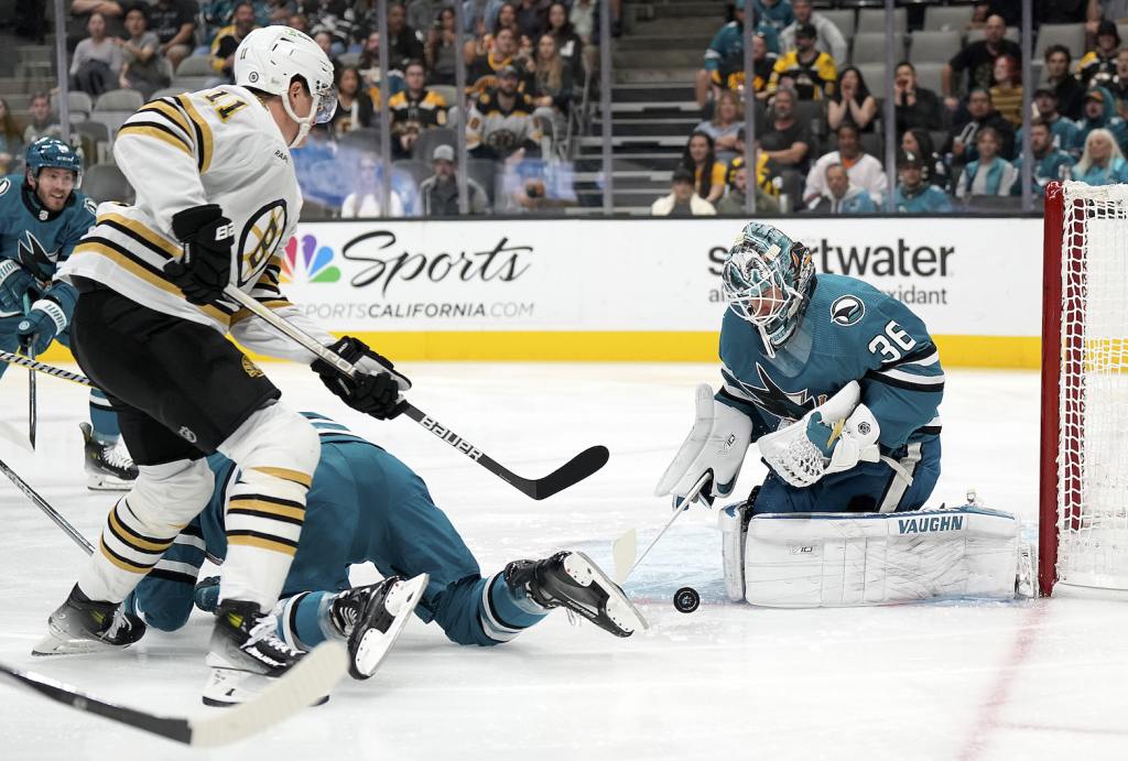 SAN JOSE, CALIFORNIA - OCTOBER 19: Goalie Kaapo Kahkonen #36 of the San Jose Sharks blocks the shot of Trent Frederic #11 of the Boston Bruins during the first period at SAP Center on October 19, 2023 in San Jose, California. (Photo by Thearon W. Henderson/Getty Images)