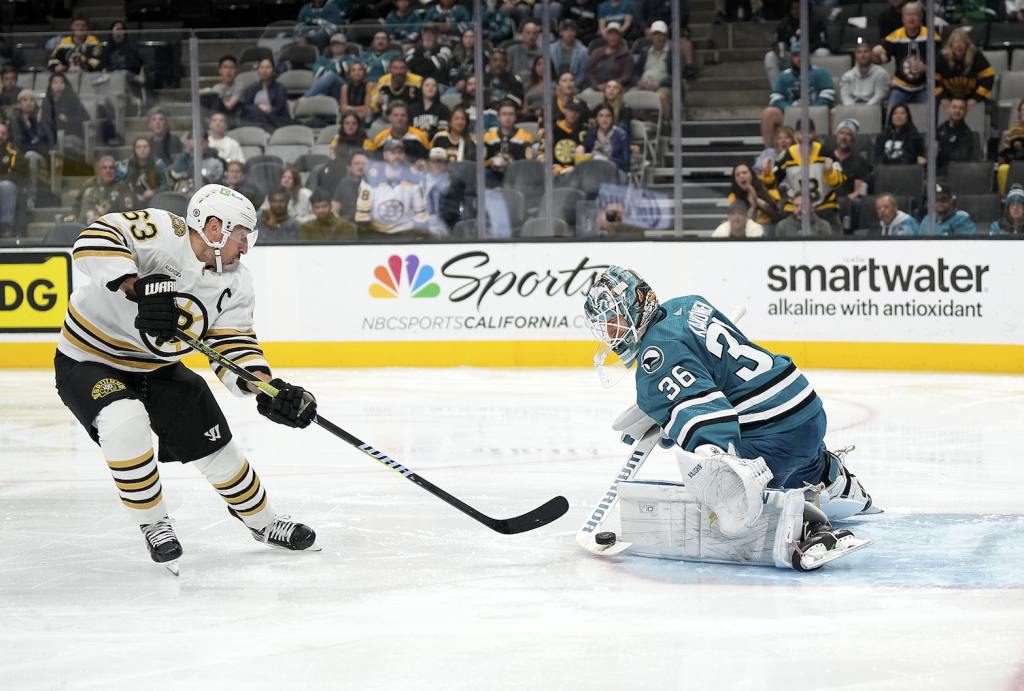 SAN JOSE, CALIFORNIA - OCTOBER 19: Goalie Kaapo Kahkonen #36 of the San Jose Sharks blocks the shot of Brad Marchand #63 of the Boston Bruins during the third period at SAP Center on October 19, 2023 in San Jose, California. (Photo by Thearon W. Henderson/Getty Images)