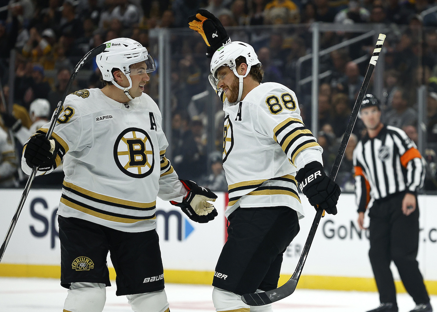 LOS ANGELES, CALIFORNIA - OCTOBER 21: David Pastrnak #88 celebrates a goal with Charlie McAvoy #73 of the Boston Bruins against the Los Angeles Kings in the first period at Crypto.com Arena on October 21, 2023 in Los Angeles, California. (Photo by Ronald Martinez/Getty Images)