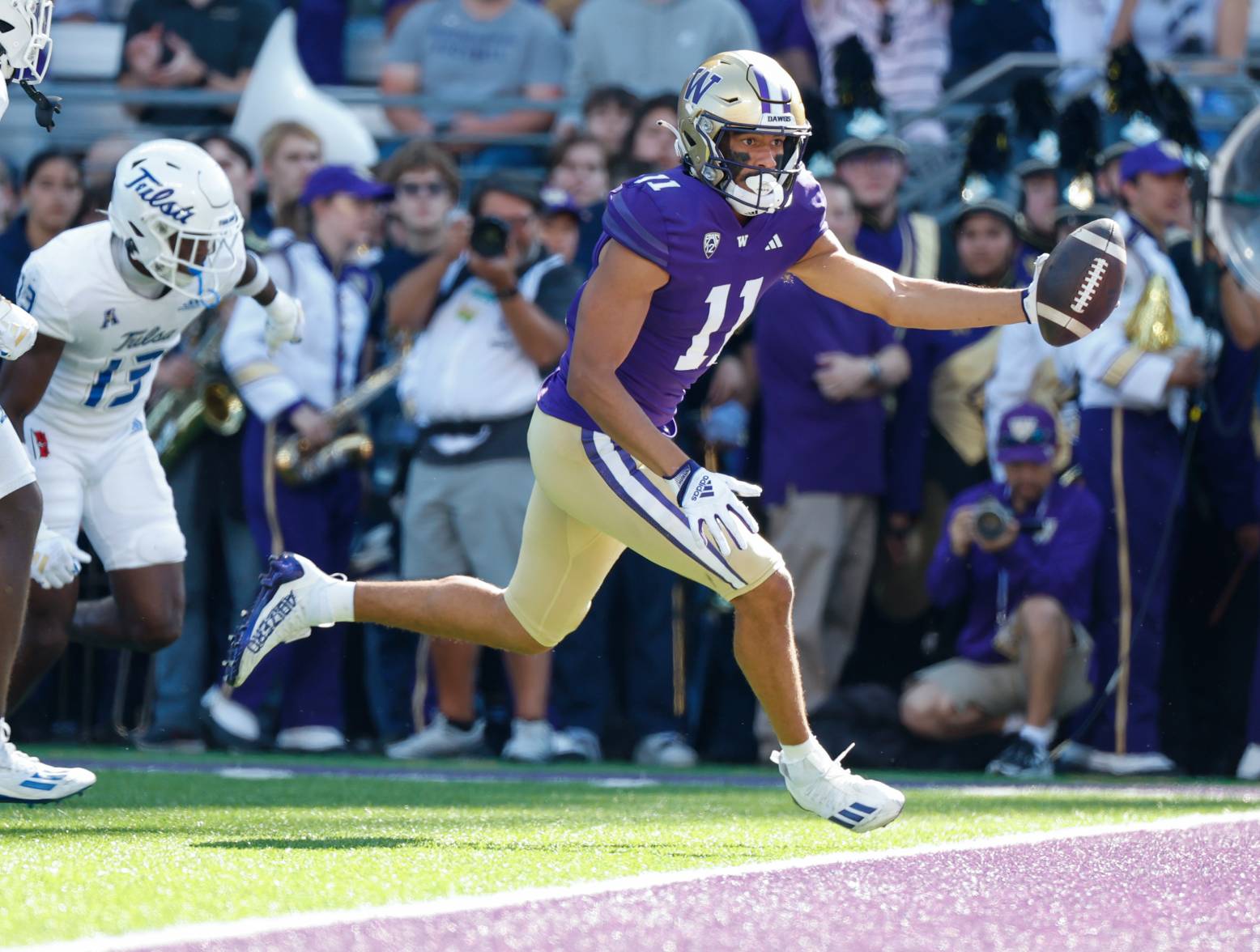Sep 9, 2023; Seattle, Washington, USA; Washington Huskies wide receiver Jalen McMillan (11) extends the ball out for a receiving touchdown against the Tulsa Golden Hurricane during the second quarter at Alaska Airlines Field at Husky Stadium. Credit: Joe Nicholson-USA TODAY Sports