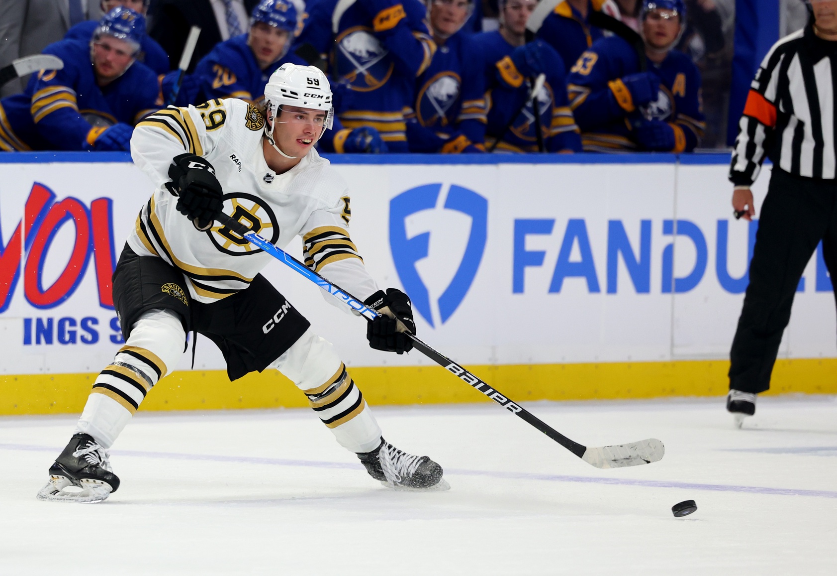 Sep 26, 2023; Buffalo, New York, USA; Boston Bruins defenseman Frederic Brunet (59) makes a pass during the third period against the Buffalo Sabres at KeyBank Center. Mandatory Credit: Timothy T. Ludwig/USA TODAY Sports
