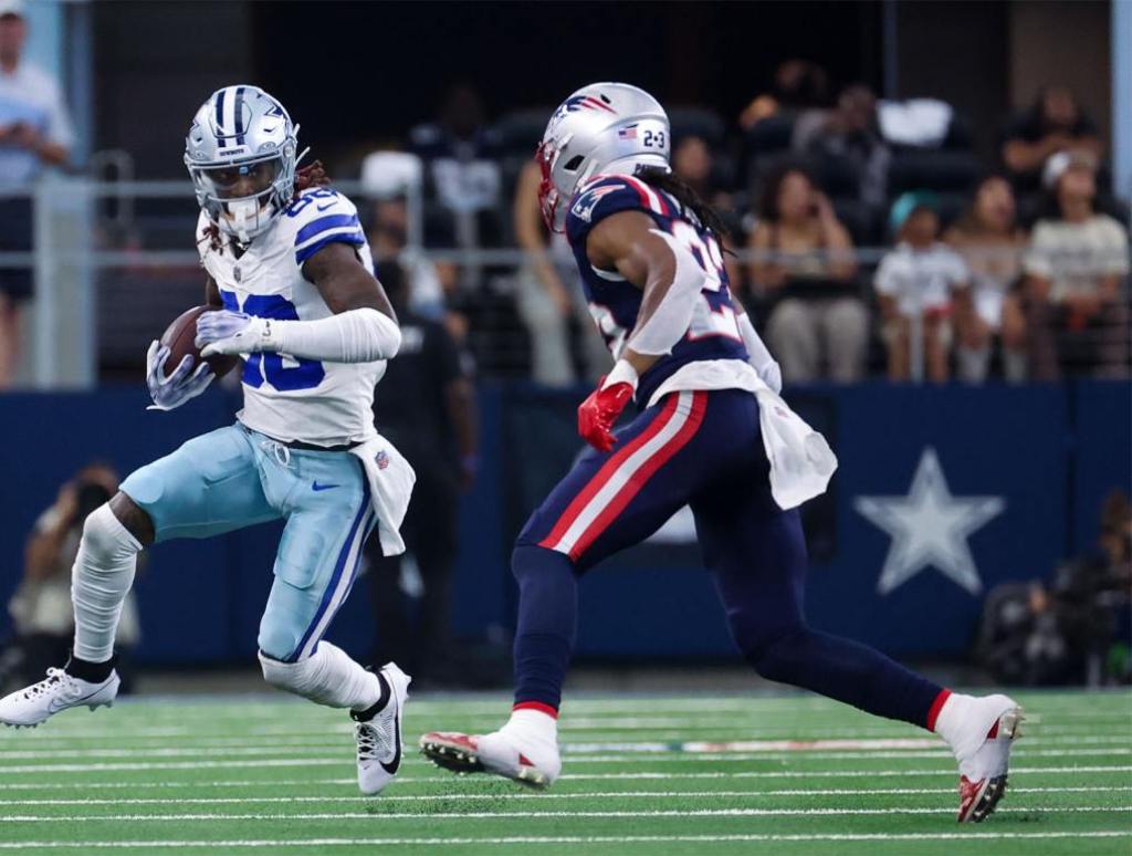 Oct 1, 2023; Arlington, Texas, USA; Dallas Cowboys wide receiver CeeDee Lamb (88) runs with the ball as New England Patriots safety Kyle Dugger (23) defends during the first quarter at AT&T Stadium. Mandatory Credit: Kevin Jairaj-USA TODAY Sports