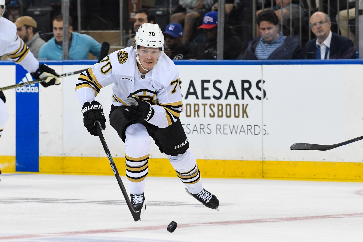 Oct 5, 2023; New York, New York, USA; Boston Bruins center Jesper Boqvist (70) skates across center ice against the New York Rangers during the second at Madison Square Garden. Mandatory Credit: Dennis Schneidler-USA TODAY Sports