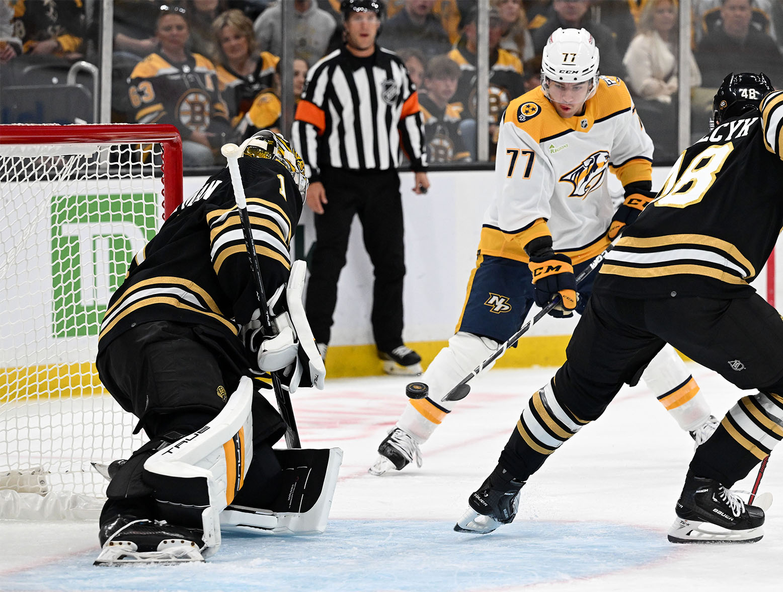 Oct 14, 2023; Boston, Massachusetts, USA; Nashville Predators right wing Luke Evangelista (77) attempts a shot against Boston Bruins goaltender Jeremy Swayman (1) during the first period at the TD Garden. Mandatory Credit: Brian Fluharty-USA TODAY Sports