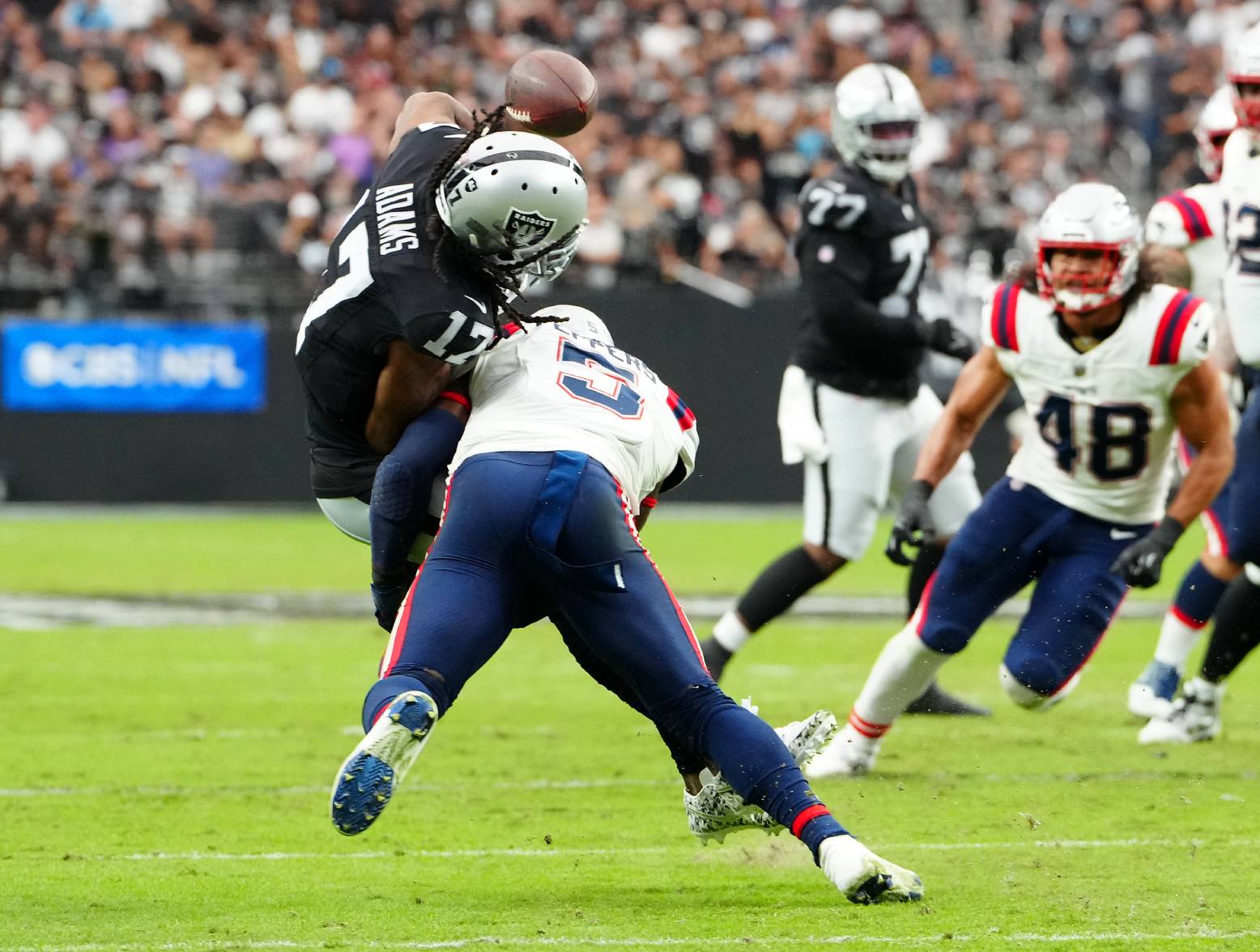 Oct 15, 2023; Paradise, Nevada, USA; New England Patriots safety Jabrill Peppers (5) tackles Las Vegas Raiders wide receiver Davante Adams (17) during the first quarter at Allegiant Stadium. Credit: Stephen R. Sylvanie-USA TODAY Sports