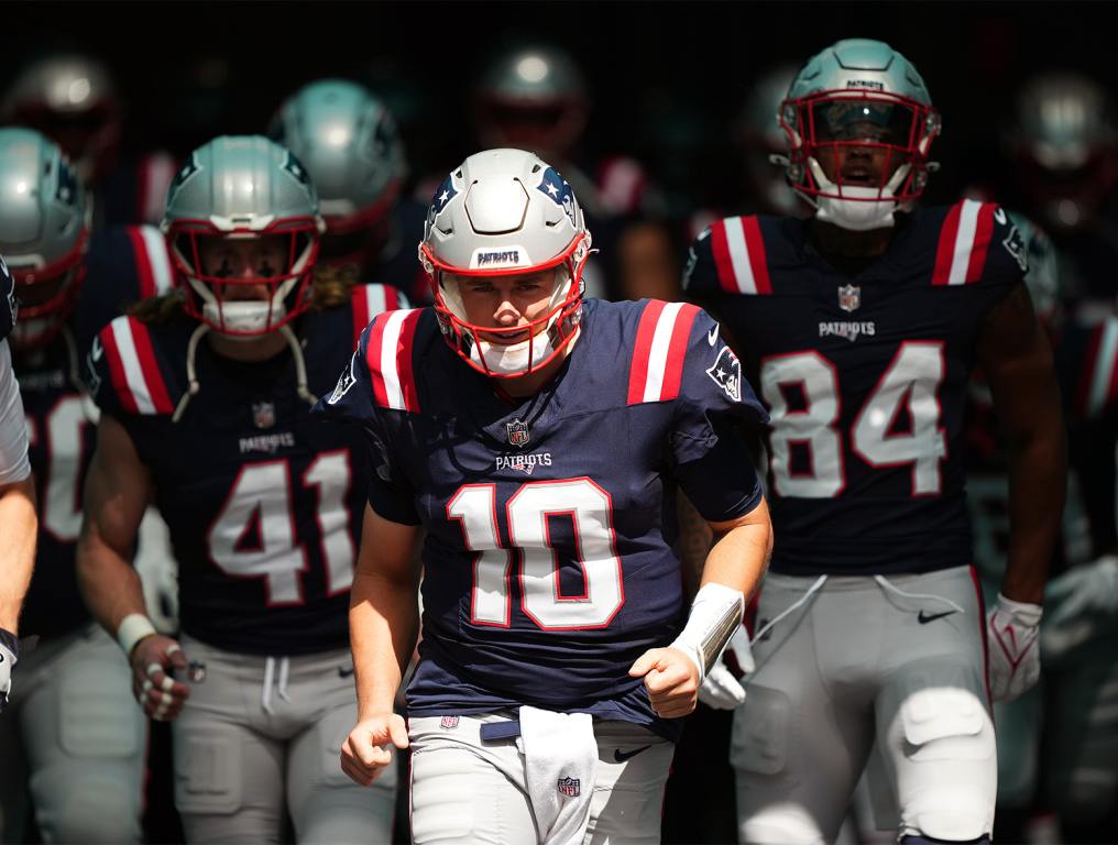 Oct 29, 2023; Miami Gardens, Florida, USA; New England Patriots quarterback Mac Jones (10) leads the team to the field prior to the game against the Miami Dolphins at Hard Rock Stadium. Mandatory Credit: Jasen Vinlove-USA TODAY Sports