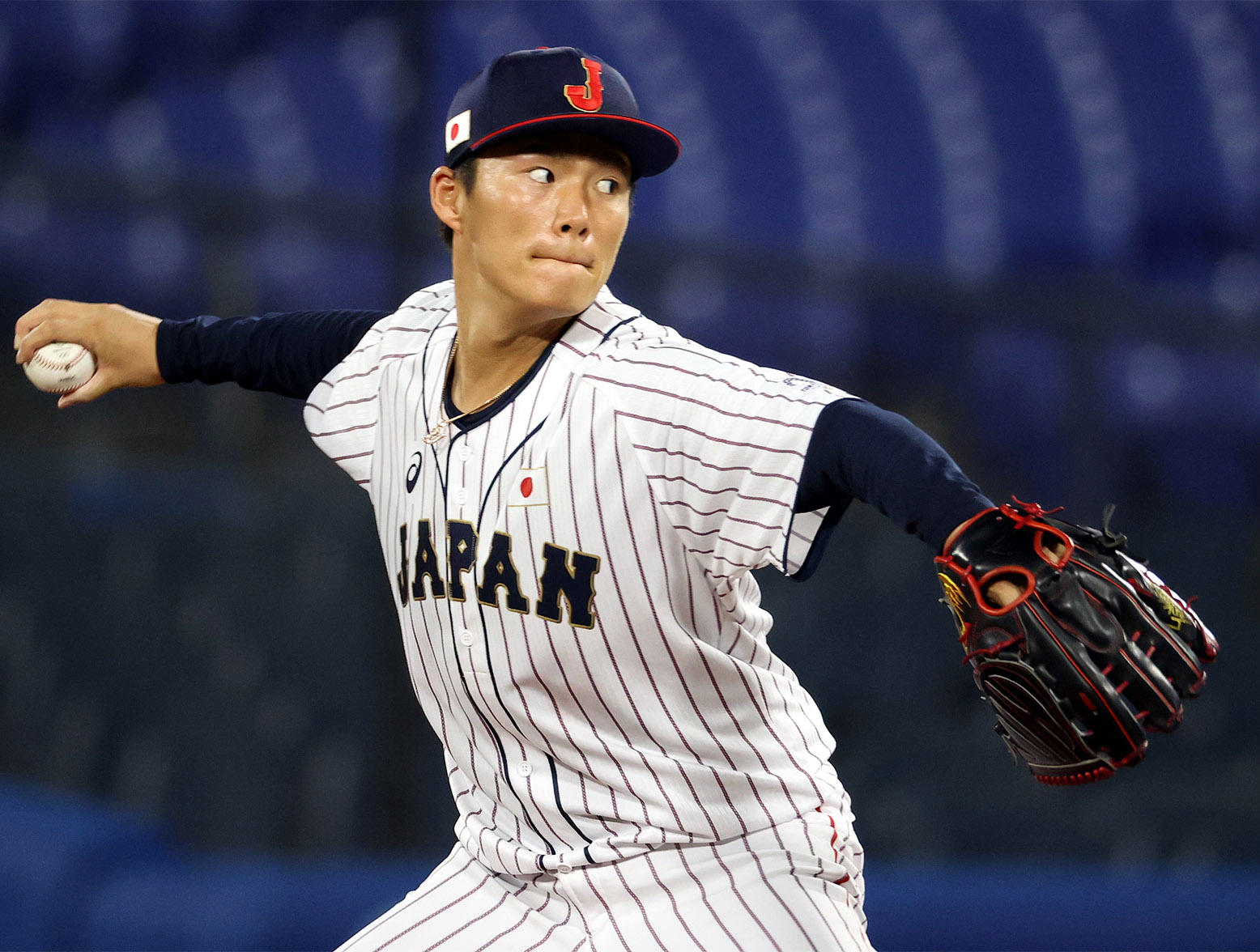 YOKOHAMA, JAPAN - AUGUST 04: Yoshinobu Yamamoto #17 of Team Japan pitches in the first inning against Team Republic of Korea during the semifinals of men's baseball on day twelve of the Tokyo 2020 Olympic Games at Yokohama Baseball Stadium on August 04, 2021 in Yokohama, Japan. (Photo by Koji Watanabe/Getty Images)