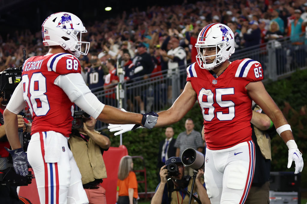 FOXBOROUGH, MASSACHUSETTS - SEPTEMBER 17: Hunter Henry #85 of the New England Patriots celebrates his touchdown catch with Mike Gesicki #88 during the fourth quarter against the Miami Dolphins at Gillette Stadium on September 17, 2023 in Foxborough, Massachusetts. (Photo by Maddie Meyer/Getty Images)