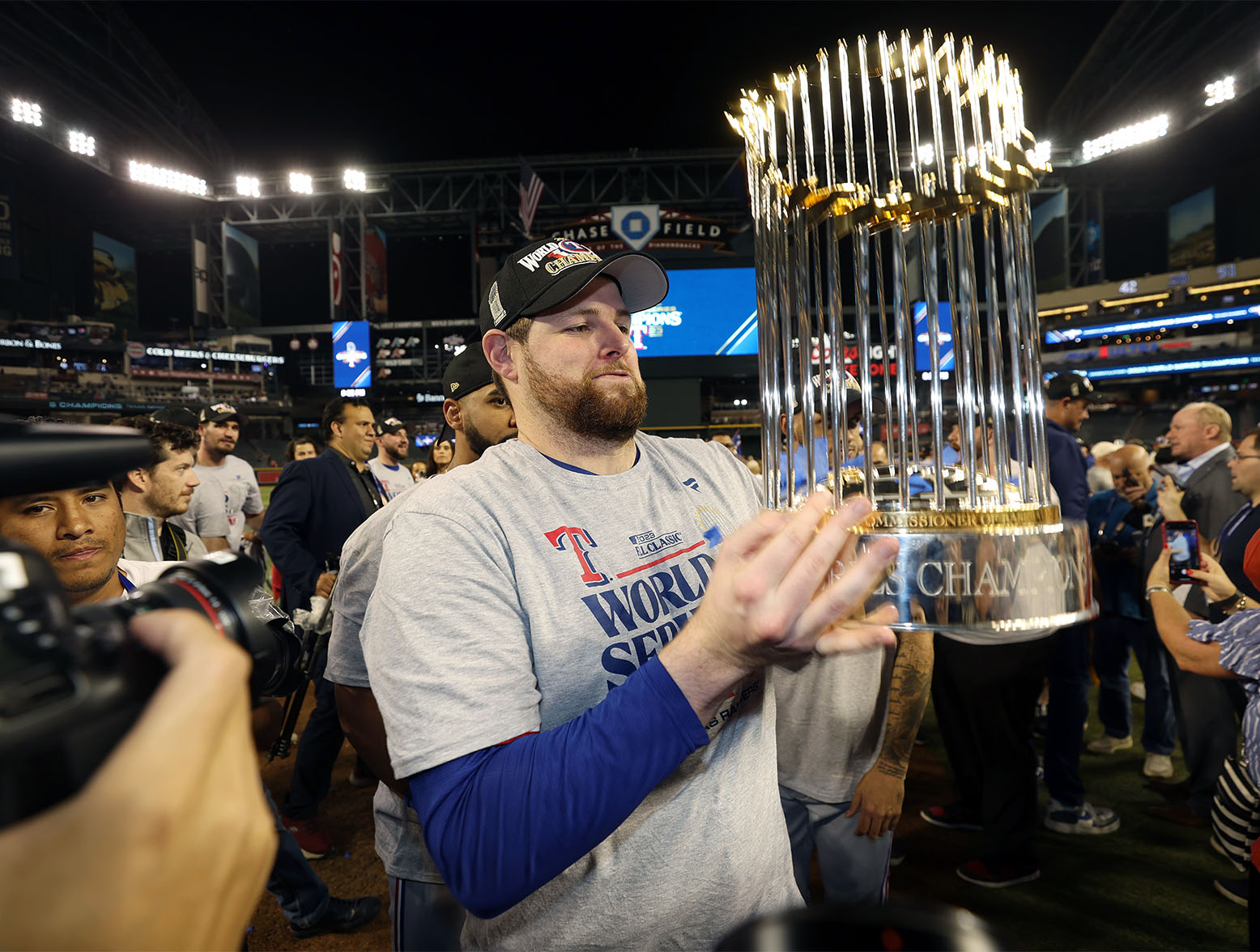 PHOENIX, ARIZONA - NOVEMBER 01: Jordan Montgomery #52 of the Texas Rangers celebrates with the Commissioner's Trophy after the Texas Rangers beat the Arizona Diamondbacks 5-0 in Game Five to win the World Series at Chase Field on November 01, 2023 in Phoenix, Arizona. (Photo by Christian Petersen/Getty Images)