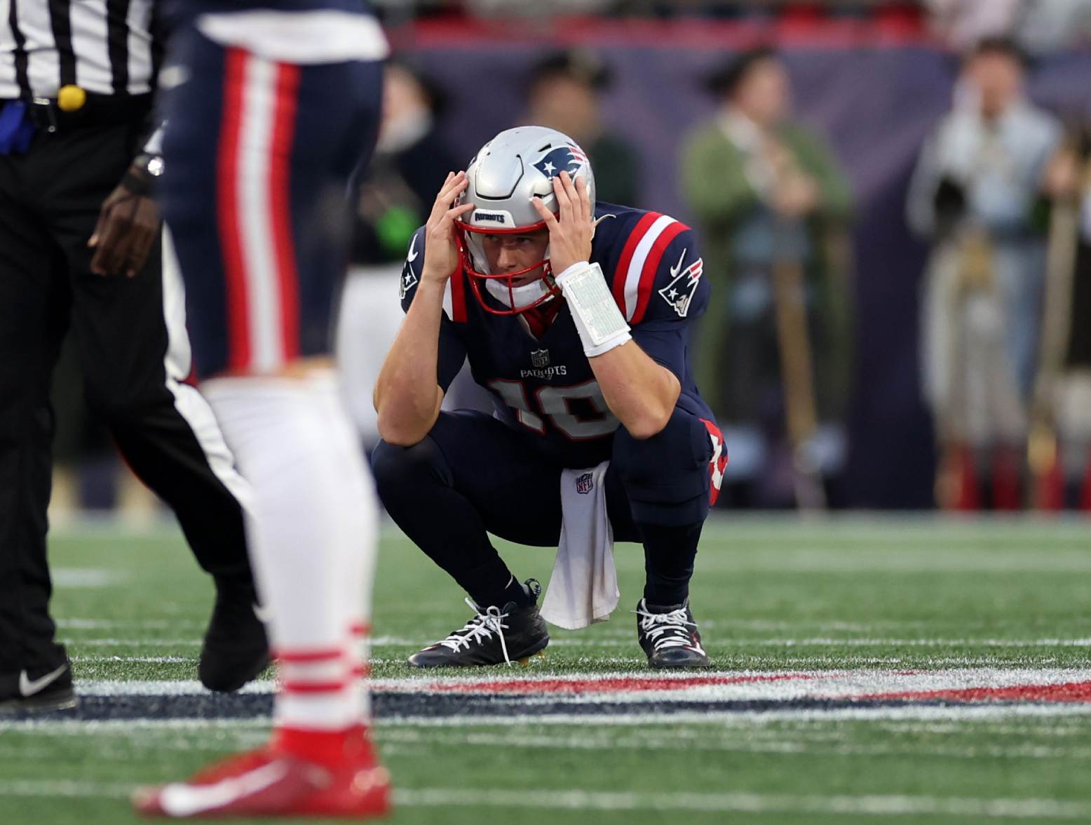 FOXBOROUGH, MASSACHUSETTS - NOVEMBER 05: Mac Jones #10 of the New England Patriots reacts after an interception during the second half in the game against the Washington Commanders at Gillette Stadium on November 05, 2023 in Foxborough, Massachusetts. (Photo by Maddie Meyer/Getty Images)