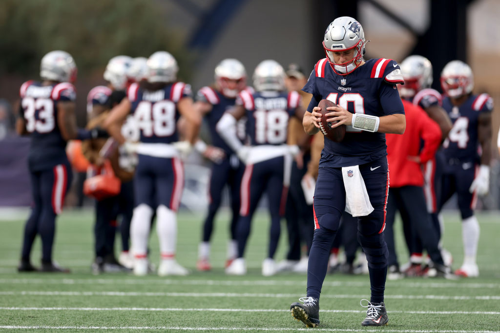 FOXBOROUGH, MASSACHUSETTS - NOVEMBER 05: Mac Jones #10 of the New England Patriots looks to pass during the second half against the Washington Commanders at Gillette Stadium on November 05, 2023 in Foxborough, Massachusetts. (Photo by Maddie Meyer/Getty Images)