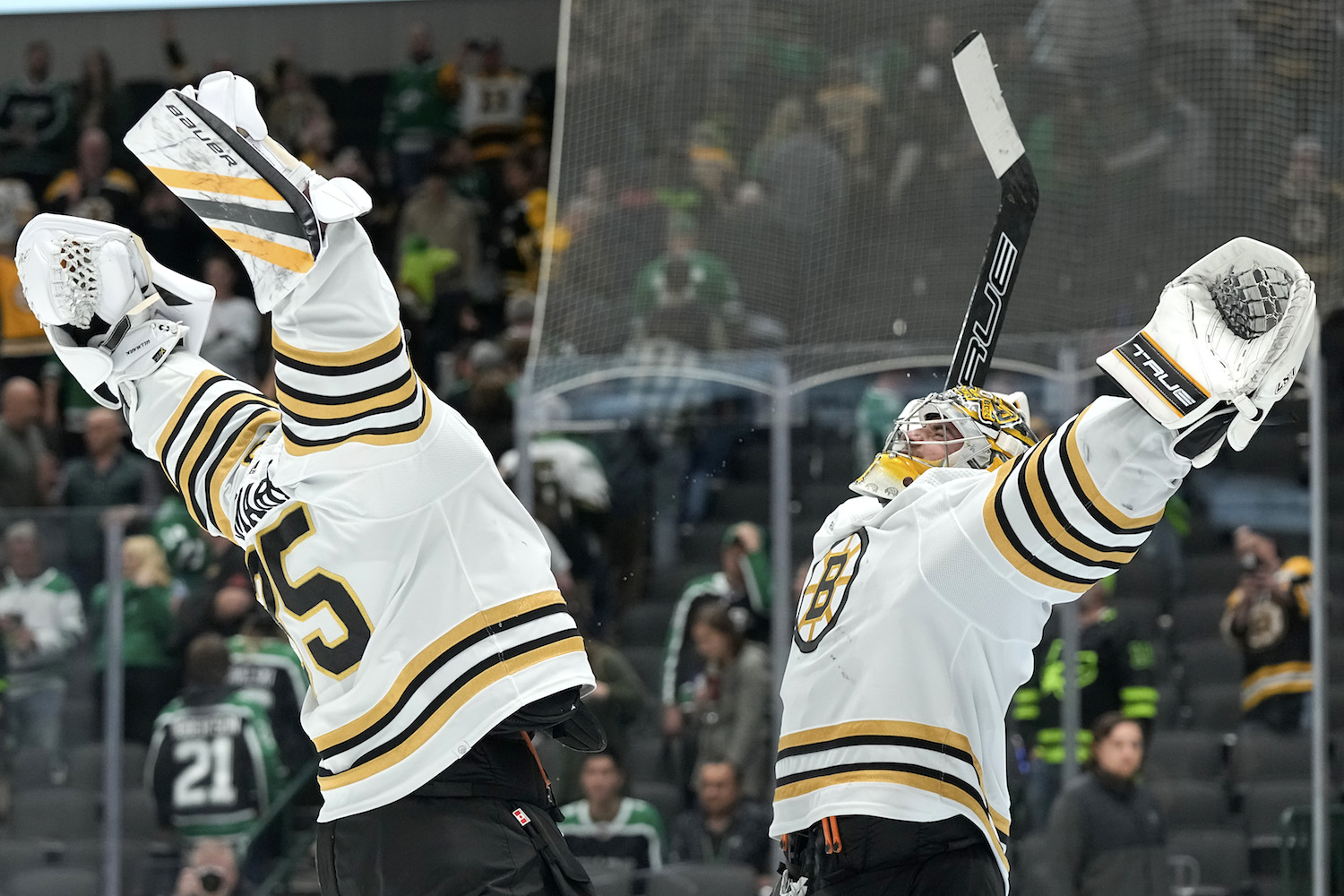 DALLAS, TEXAS - NOVEMBER 06: Linus Ullmark #35 of the Boston Bruins and Jeremy Swayman #1 celebrate after defeating the Dallas Stars at American Airlines Center on November 06, 2023 in Dallas, Texas. (Photo by Sam Hodde/Getty Images)