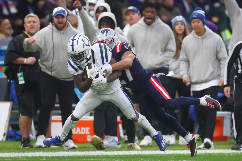 FRANKFURT AM MAIN, GERMANY - NOVEMBER 12: Isaiah McKenzie #6 of the Indianapolis Colts is tackled by Myles Bryant #27 of the New England Patriots in the first quarter during the NFL match between the Indianapolis Colts and the New England Patriots at Deutsche Bank Park on November 12, 2023 in Frankfurt am Main, Germany. (Photo by Alex Grimm/Getty Images)