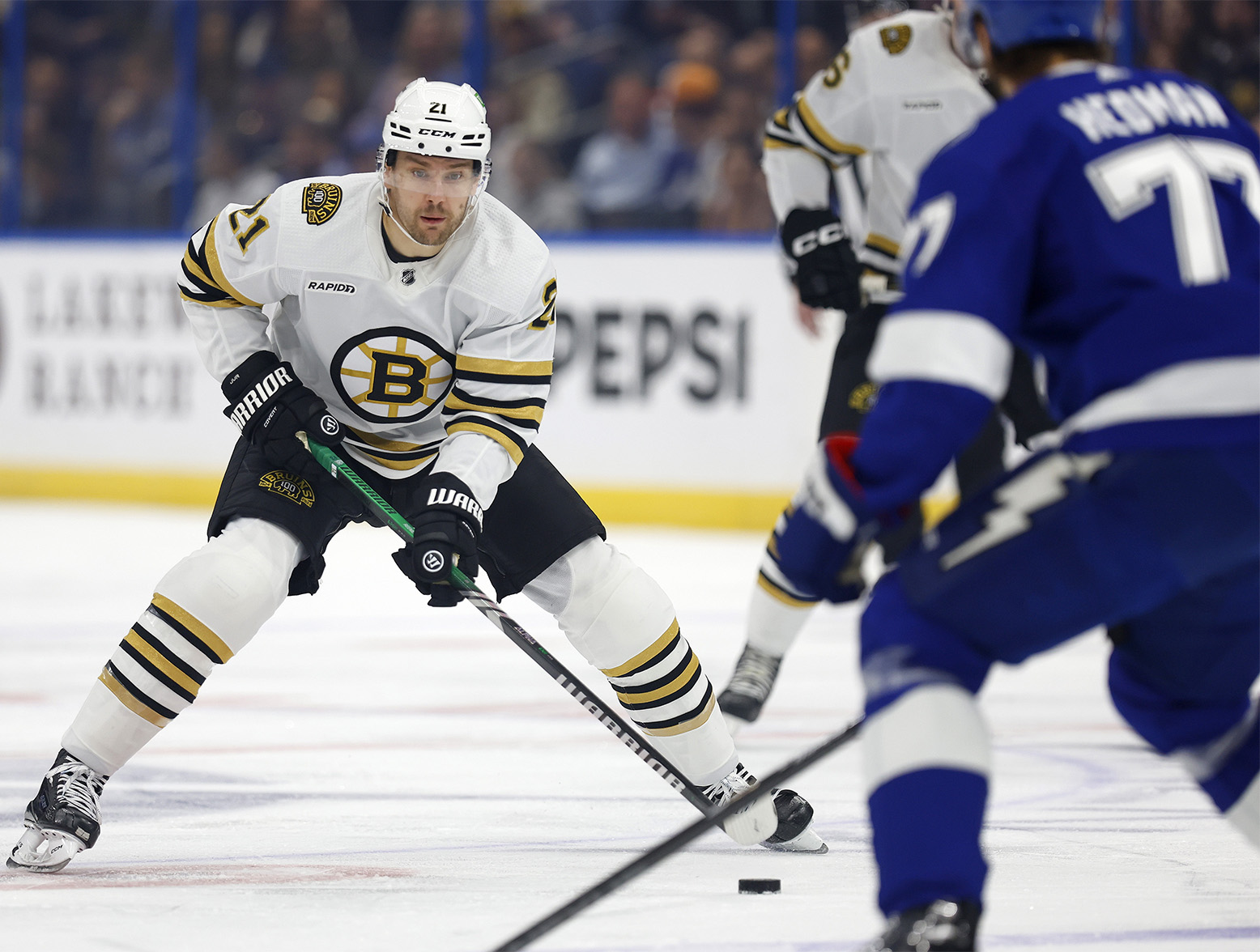 TAMPA, FLORIDA - NOVEMBER 20: James van Riemsdyk #21 of the Boston Bruins looks to pass in the first period during a game against the Tampa Bay Lightning at Amalie Arena on November 20, 2023 in Tampa, Florida. (Photo by Mike Ehrmann/Getty Images)