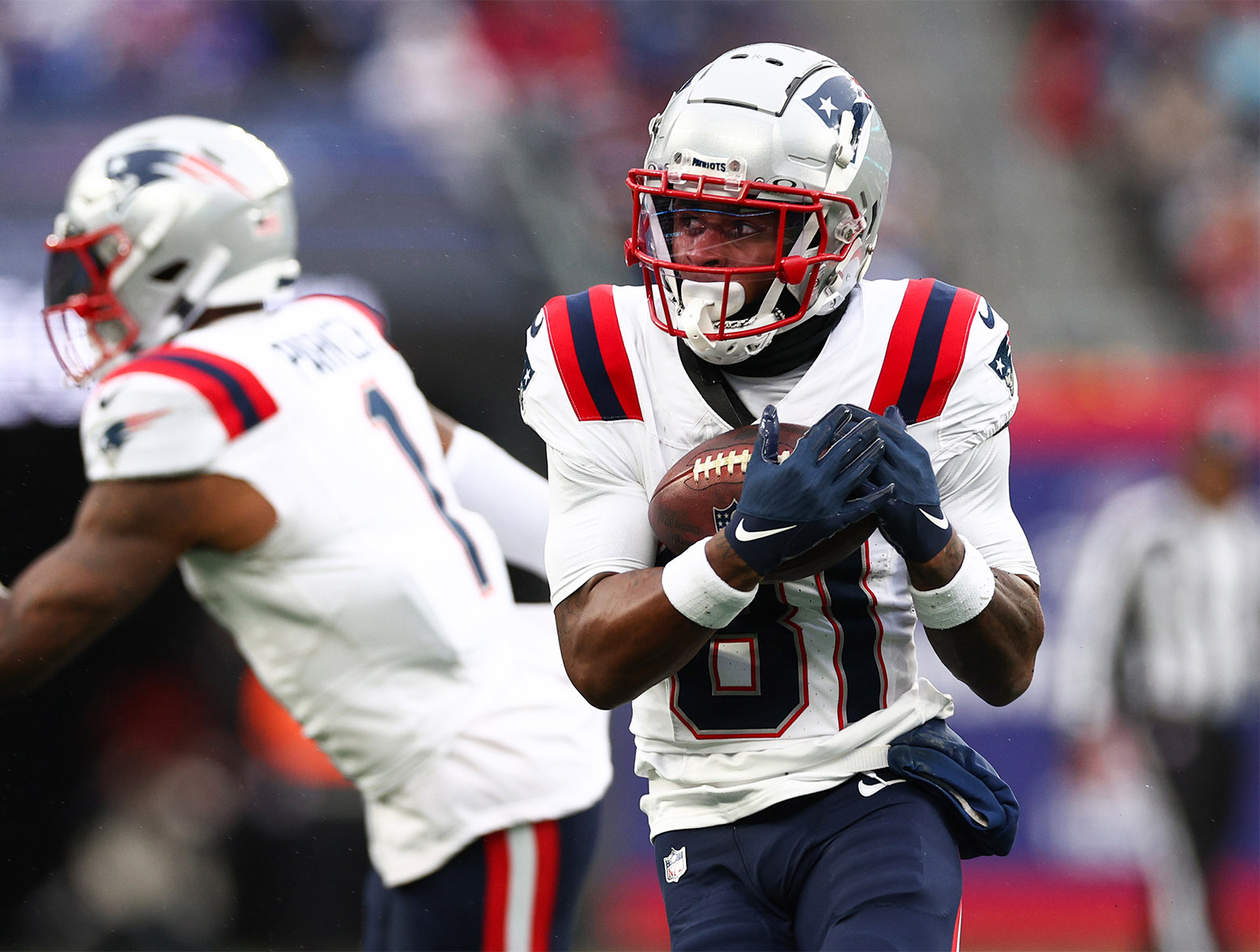 EAST RUTHERFORD, NEW JERSEY - NOVEMBER 26: Demario Douglas #81 of the New England Patriots catches a pass during the second quarter against the New York Giants at MetLife Stadium on November 26, 2023 in East Rutherford, New Jersey. (Photo by Elsa/Getty Images)