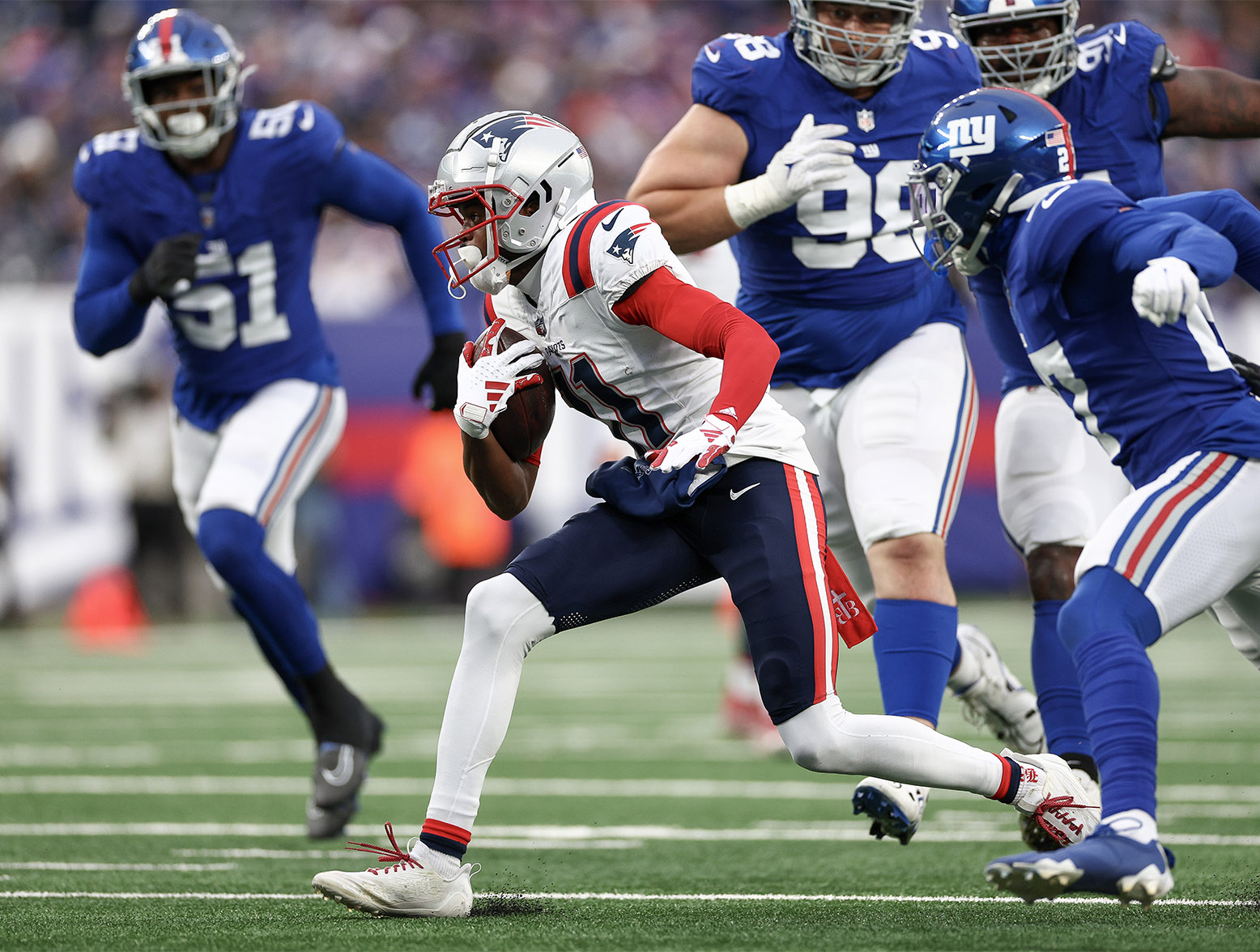 EAST RUTHERFORD, NEW JERSEY - NOVEMBER 26: Tyquan Thornton #11 of the New England Patriots runs after a catch during the third quarter against the New York Giants at MetLife Stadium on November 26, 2023 in East Rutherford, New Jersey. (Photo by Elsa/Getty Images)