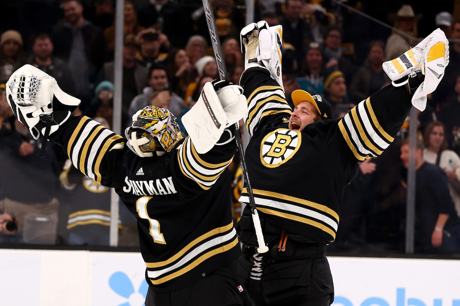 BOSTON, MASSACHUSETTS - NOVEMBER 30: Jeremy Swayman #1 of the Boston Bruins and Linus Ullmark #35 celebrate after the Bruins defeat the San Jose Sharks 3-0 at TD Garden on November 30, 2023 in Boston, Massachusetts. (Photo by Maddie Meyer/Getty Images)