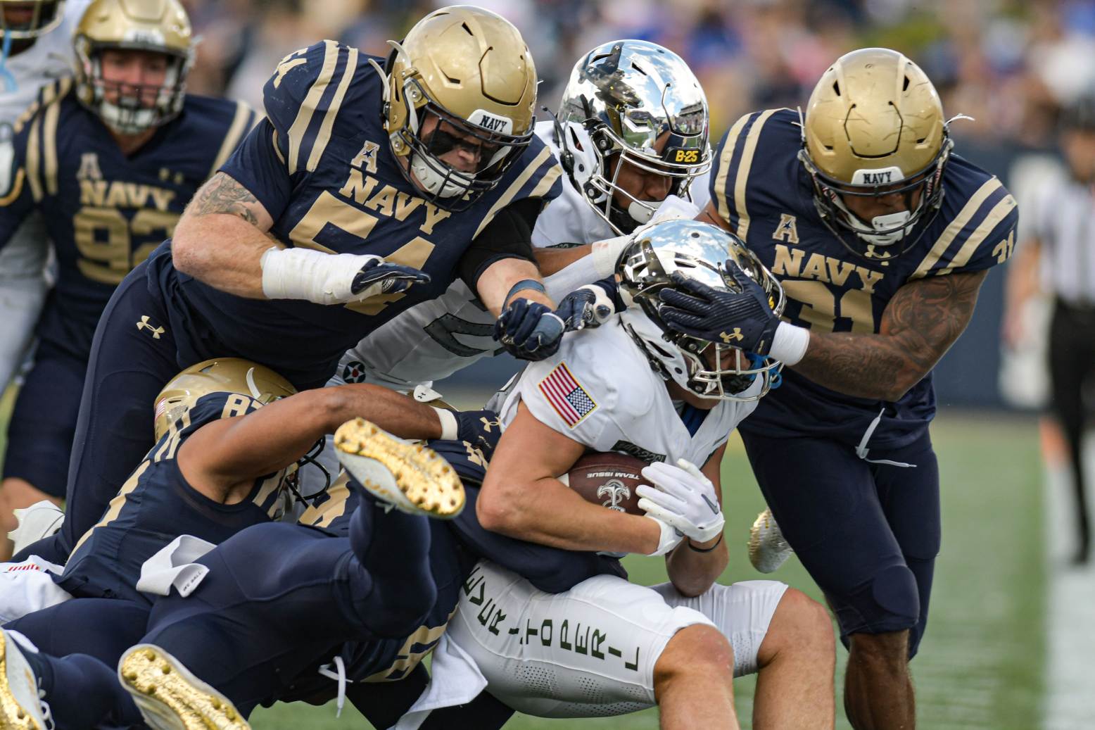 Oct 21, 2023; Annapolis, Maryland, USA; Air Force Falcons wide receiver Dane Kinamon (23) is swarmed by Navy Midshipmen defense during the first half at Navy-Marine Corps Memorial Stadium. Credit: Tommy Gilligan-USA TODAY Sports