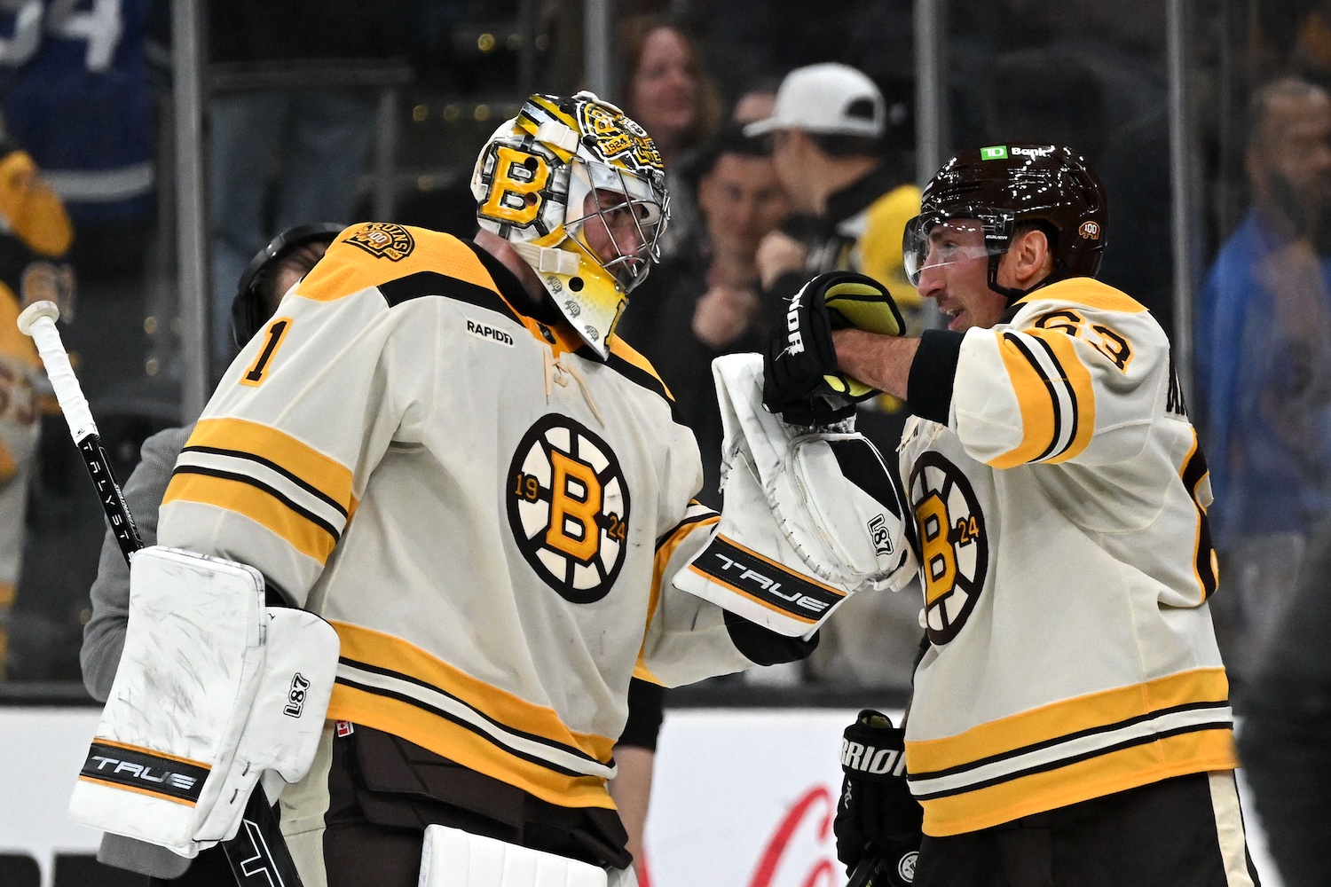 Nov 2, 2023; Boston, Massachusetts, USA; Boston Bruins left wing Brad Marchand (63) celebrates with goaltender Jeremy Swayman (1) after an overtime win against the Toronto Maple Leafs at the TD Garden. Mandatory Credit: Brian Fluharty-USA TODAY Sports