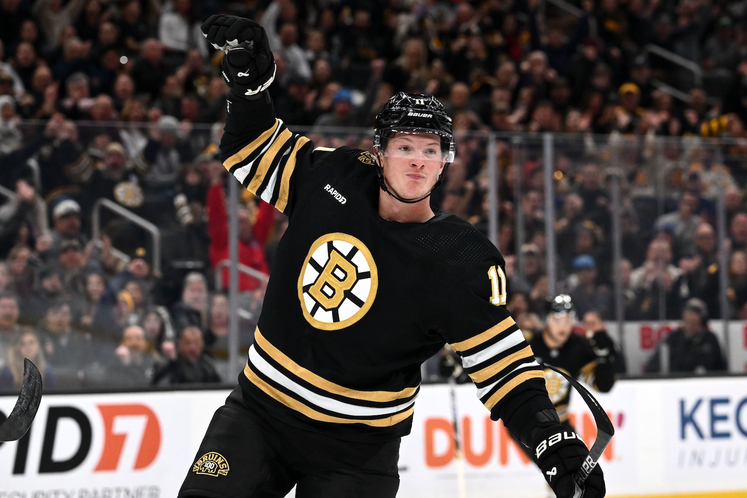 Nov 9, 2023; Boston, Massachusetts, USA; Boston Bruins center Trent Frederic (11) reacts after scoring a goal against the New York Islanders during the first period at the TD Garden. Mandatory Credit: Brian Fluharty-USA TODAY Sports