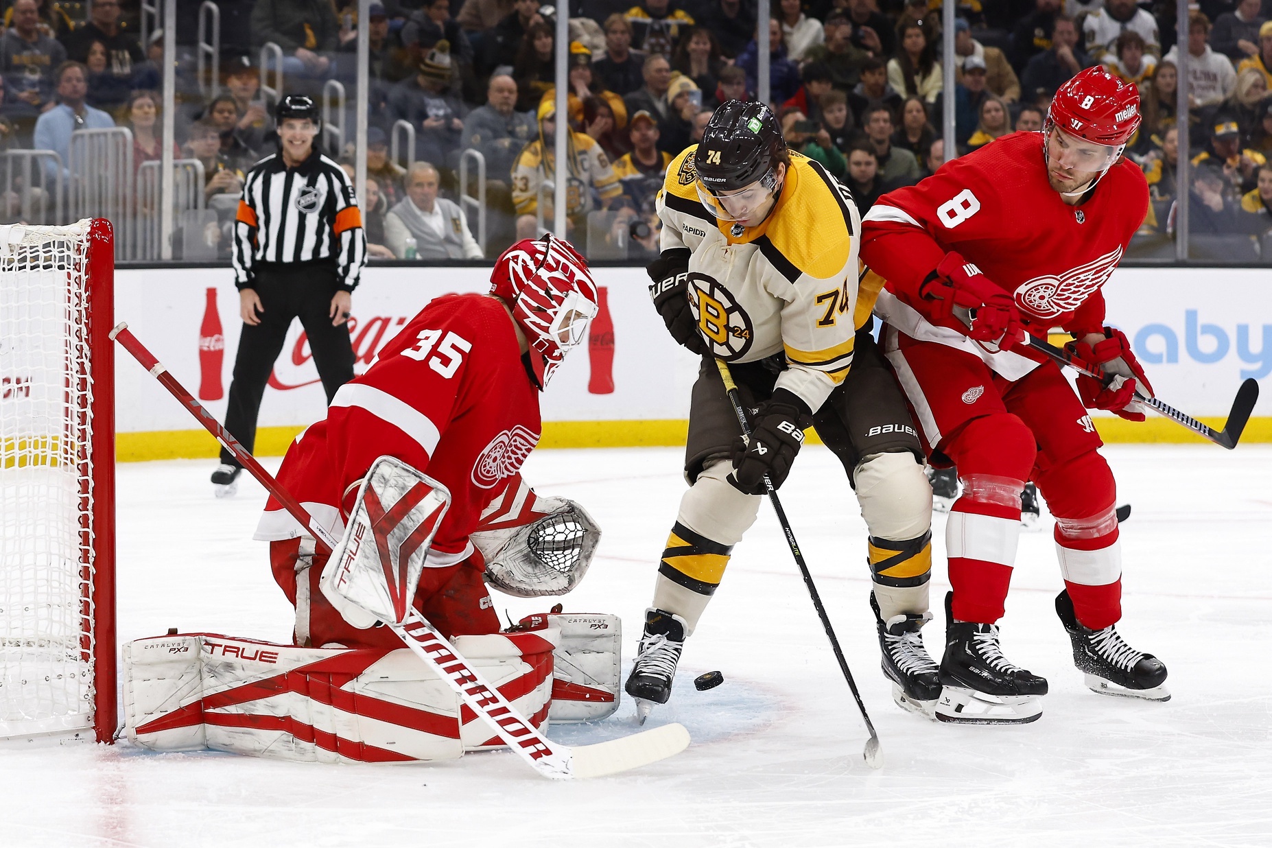 Nov 24, 2023; Boston, Massachusetts, USA; Boston Bruins left wing Jake DeBrusk (74) looks for a rebound in front of Detroit Red Wings goaltender Ville Husso (35) during the first period at TD Garden. Mandatory Credit: Winslow Townson-USA TODAY Sports