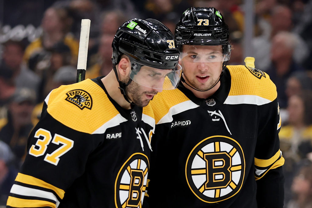 BOSTON, MASSACHUSETTS - APRIL 26: Patrice Bergeron #37 and Charlie McAvoy #73 of the Boston Bruins talk against the Florida Panthers during the second period in Game Five of the First Round of the 2023 Stanley Cup Playoffs at TD Garden on April 26, 2023 in Boston, Massachusetts. (Photo by Maddie Meyer/Getty Images)