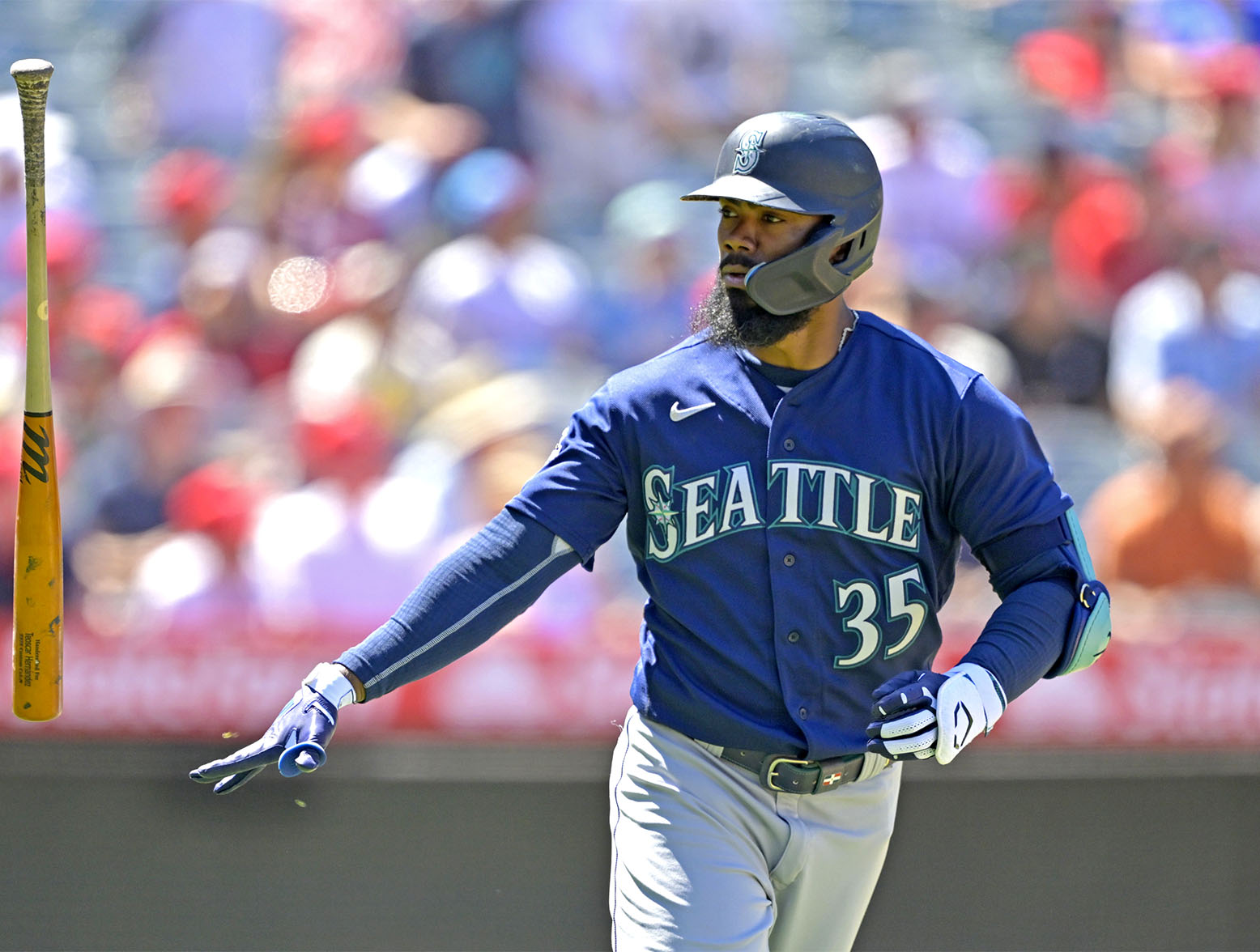 ANAHEIM, CALIFORNIA - AUGUST 6: Teoscar Hernandez #35 of the Seattle Mariners flips his bat after hitting a solo home run in the seventh inning against the Los Angeles Angels at Angel Stadium of Anaheim on August 6, 2023 in Anaheim, California. (Photo by Jayne Kamin-Oncea/Getty Images)