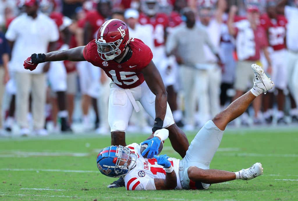 TUSCALOOSA, ALABAMA - SEPTEMBER 23: Dallas Turner #15 of the Alabama Crimson Tide tackles Jordan Watkins #11 of the Mississippi Rebels during the fourth quarter at Bryant-Denny Stadium on September 23, 2023 in Tuscaloosa, Alabama. (Photo by Kevin C. Cox/Getty Images)