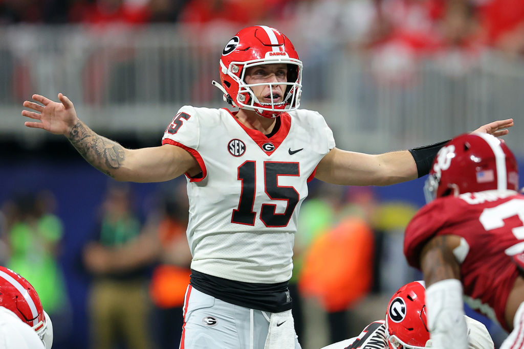 ATLANTA, GEORGIA - DECEMBER 02: Carson Beck #15 of the Georgia Bulldogs signals the play to teammates during the first quarter against the Alabama Crimson Tide in the SEC Championship at Mercedes-Benz Stadium on December 02, 2023 in Atlanta, Georgia. (Photo by Kevin C. Cox/Getty Images)