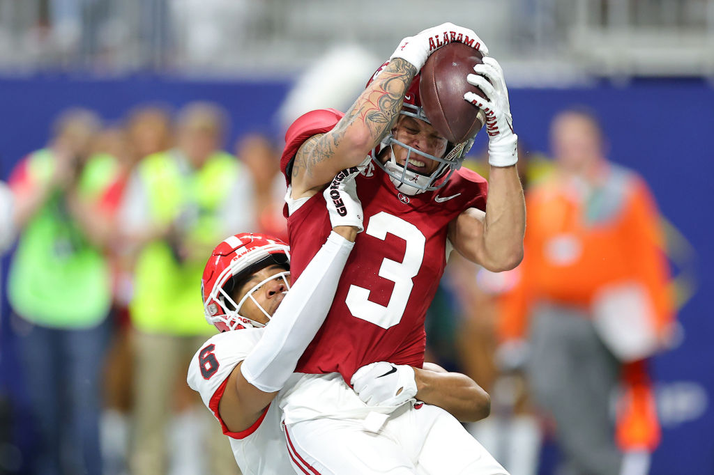 ATLANTA, GEORGIA - DECEMBER 02: Jermaine Burton #3 of the Alabama Crimson Tide catches a touchdown pass against Daylen Everette #6 of the Georgia Bulldogs during the second quarter in the SEC Championship at Mercedes-Benz Stadium on December 02, 2023 in Atlanta, Georgia. (Photo by Kevin C. Cox/Getty Images)