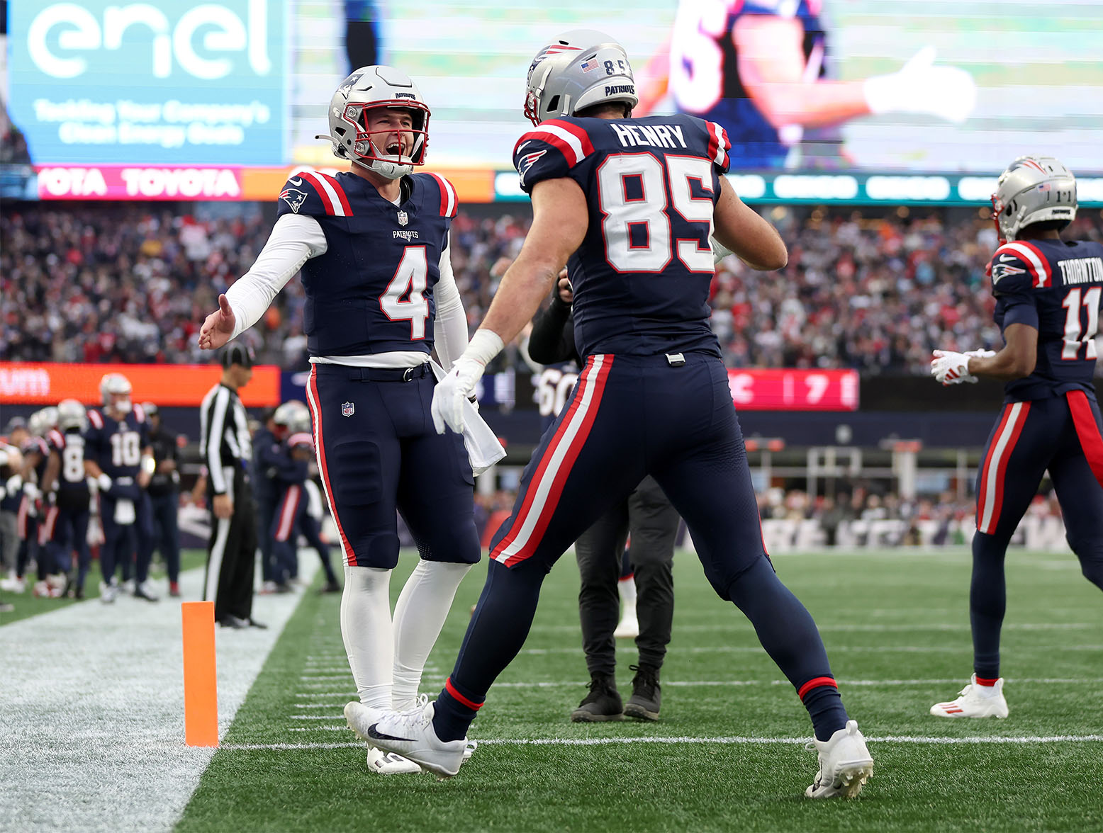 FOXBOROUGH, MASSACHUSETTS - DECEMBER 17: Bailey Zappe #4 and Hunter Henry #85 of the New England Patriots celebrate after Henry's receiving touchdown during the second quarter against the Kansas City Chiefs at Gillette Stadium on December 17, 2023 in Foxborough, Massachusetts. (Photo by Maddie Meyer/Getty Images)