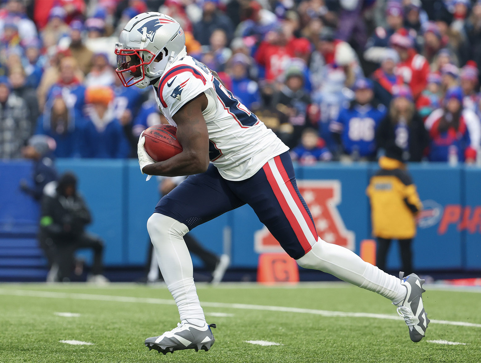 ORCHARD PARK, NEW YORK - DECEMBER 31: Jalen Reagor #83 of the New England Patriots runs the kickoff back for a touchdown during the first quarter of a game against the Buffalo Bills at Highmark Stadium on December 31, 2023 in Orchard Park, New York. (Photo by Timothy T Ludwig/Getty Images)