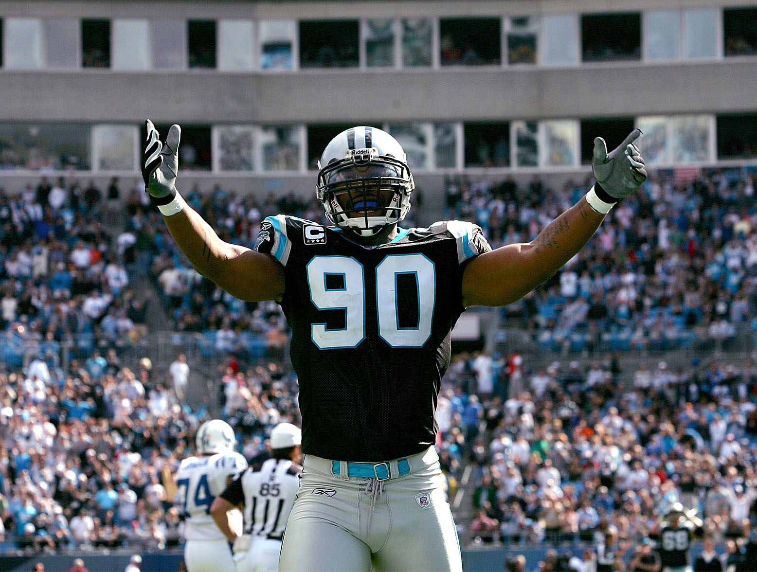 CHARLOTTE, NC - OCTOBER 28: Julius Peppers #90 of the Carolina Panthers celebrates after a defensive stop against the Indianapolis Colts during their game at Bank of America Stadium on October 28, 2007 in Charlotte, North Carolina. (Photo by Streeter Lecka/Getty Images)