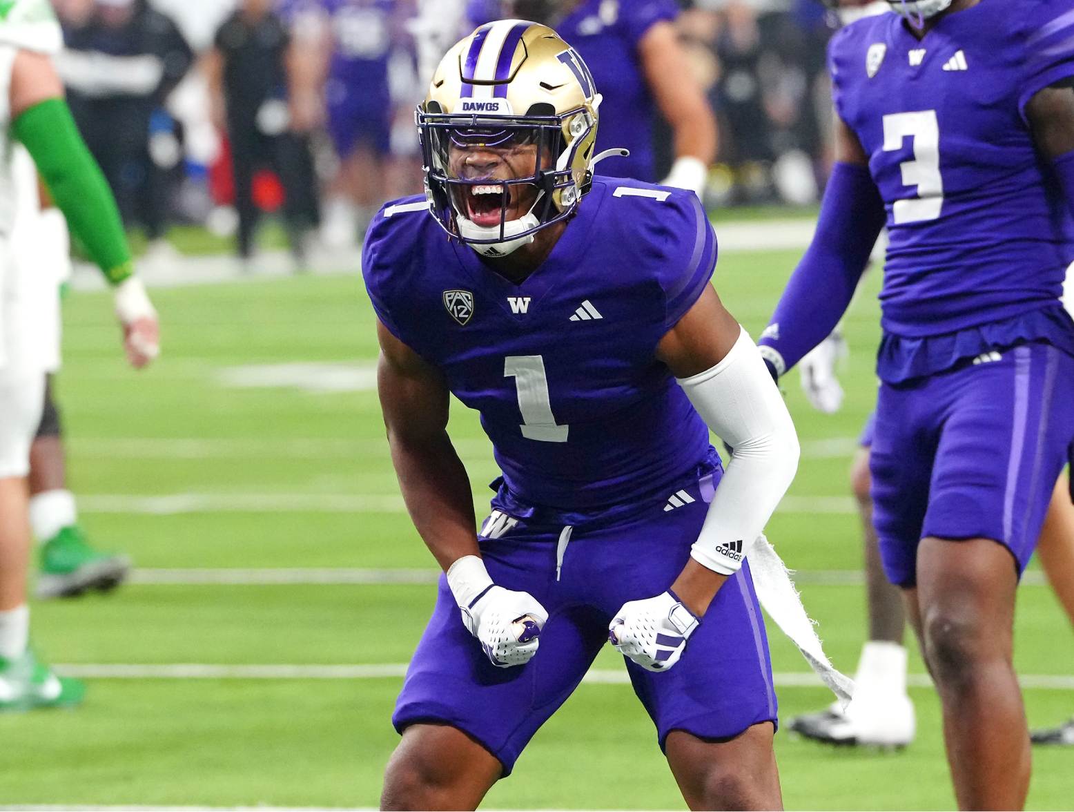 Dec 1, 2023; Las Vegas, NV, USA; Washington Huskies cornerback Jabbar Muhammad (1) celebrates after making a play against the Oregon Ducks during the second quarter at Allegiant Stadium. Credit: Stephen R. Sylvanie-USA TODAY Sports