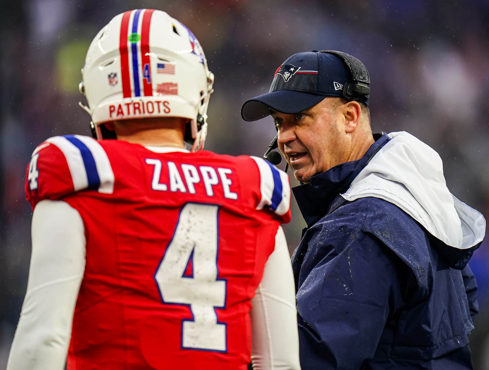 Dec 3, 2023; Foxborough, Massachusetts, USA; New England Patriots offensive coordinator Bill O'Brien talks with quarterback Bailey Zappe (4) as they take on the Los Angeles Chargers in the second quarter at Gillette Stadium. Credit: David Butler II-USA TODAY Sports