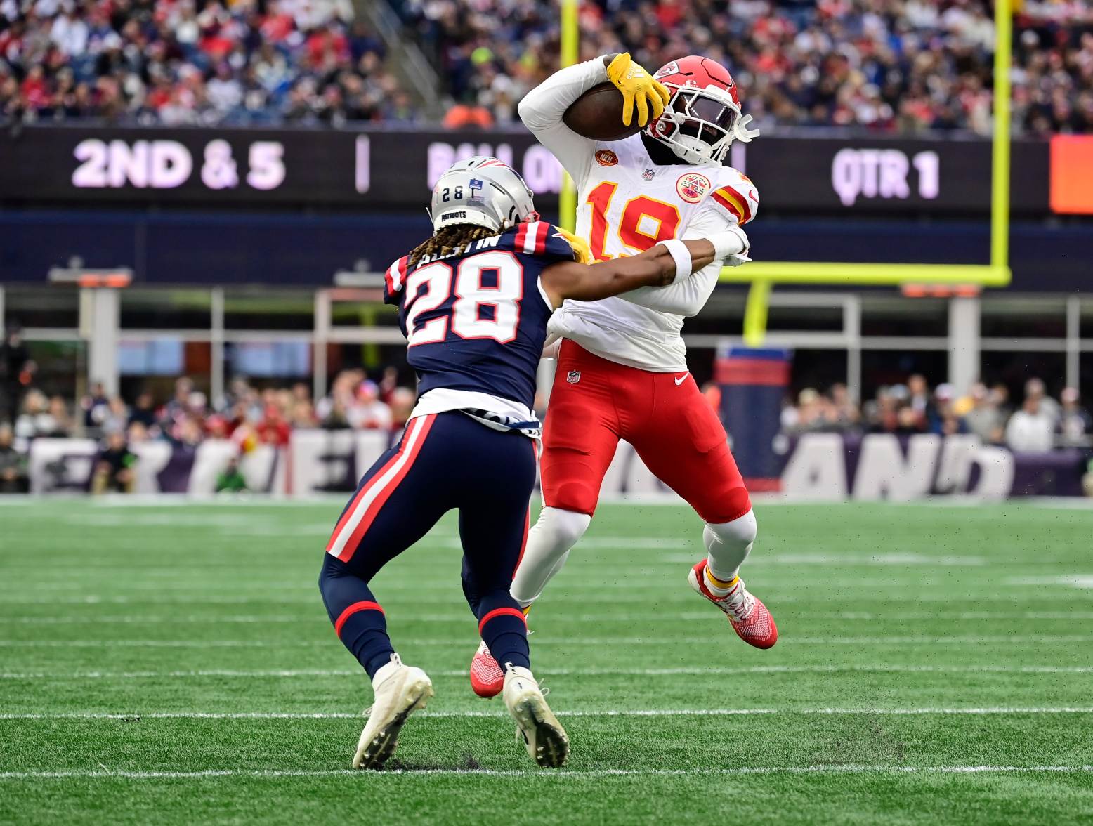 Dec 17, 2023; Foxborough, Massachusetts, USA; Kansas City Chiefs wide receiver Kadarius Toney (19) is tackled by New England Patriots cornerback Alex Austin (28) at Gillette Stadium. Credit: Eric Canha-USA TODAY Sports