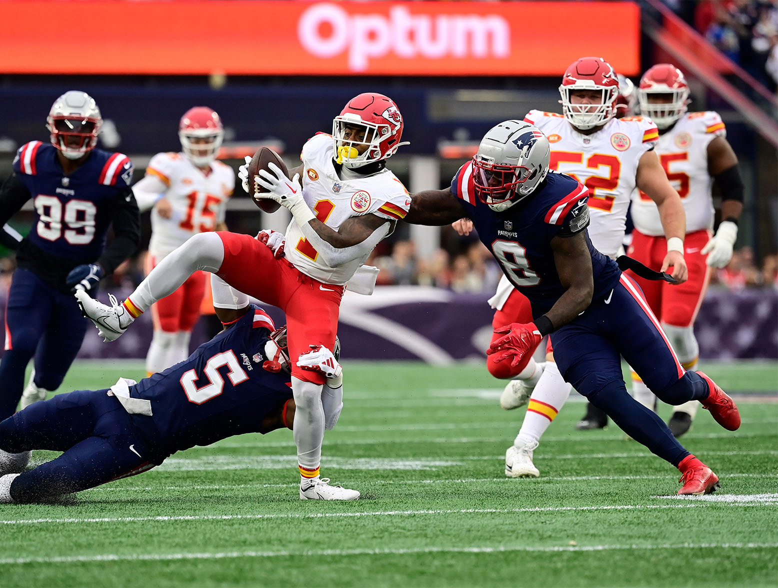 Dec 17, 2023; Foxborough, Massachusetts, USA; Kansas City Chiefs running back Jerick McKinnon (1) gets tackled by New England Patriots safety Jabrill Peppers (5) during the first half at Gillette Stadium. Mandatory Credit: Eric Canha-USA TODAY Sports