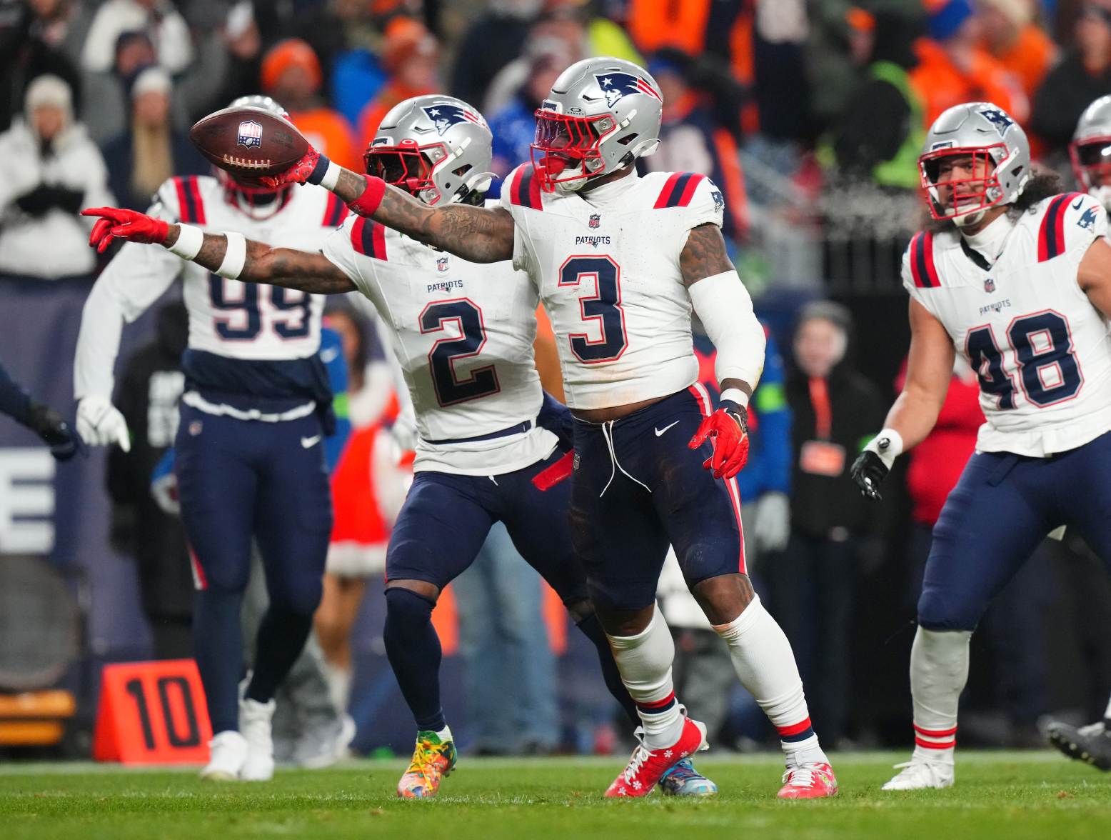 Dec 24, 2023; Denver, Colorado, USA; New England Patriots linebacker Mack Wilson Sr. (3) reacts to a defensive play in the first quarter against the Denver Broncos at Empower Field at Mile High. Credit: Ron Chenoy-USA TODAY Sports