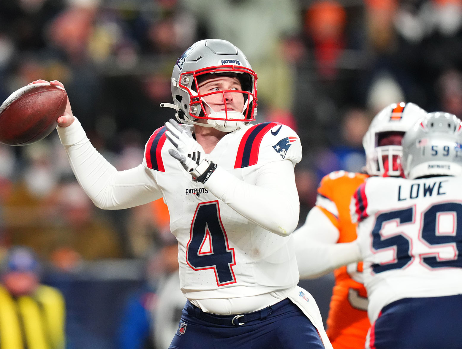 Dec 24, 2023; Denver, Colorado, USA; New England Patriots quarterback Bailey Zappe (4) prepares to pass in the first quarter against the Denver Broncos at Empower Field at Mile High. Mandatory Credit: Ron Chenoy-USA TODAY Sports