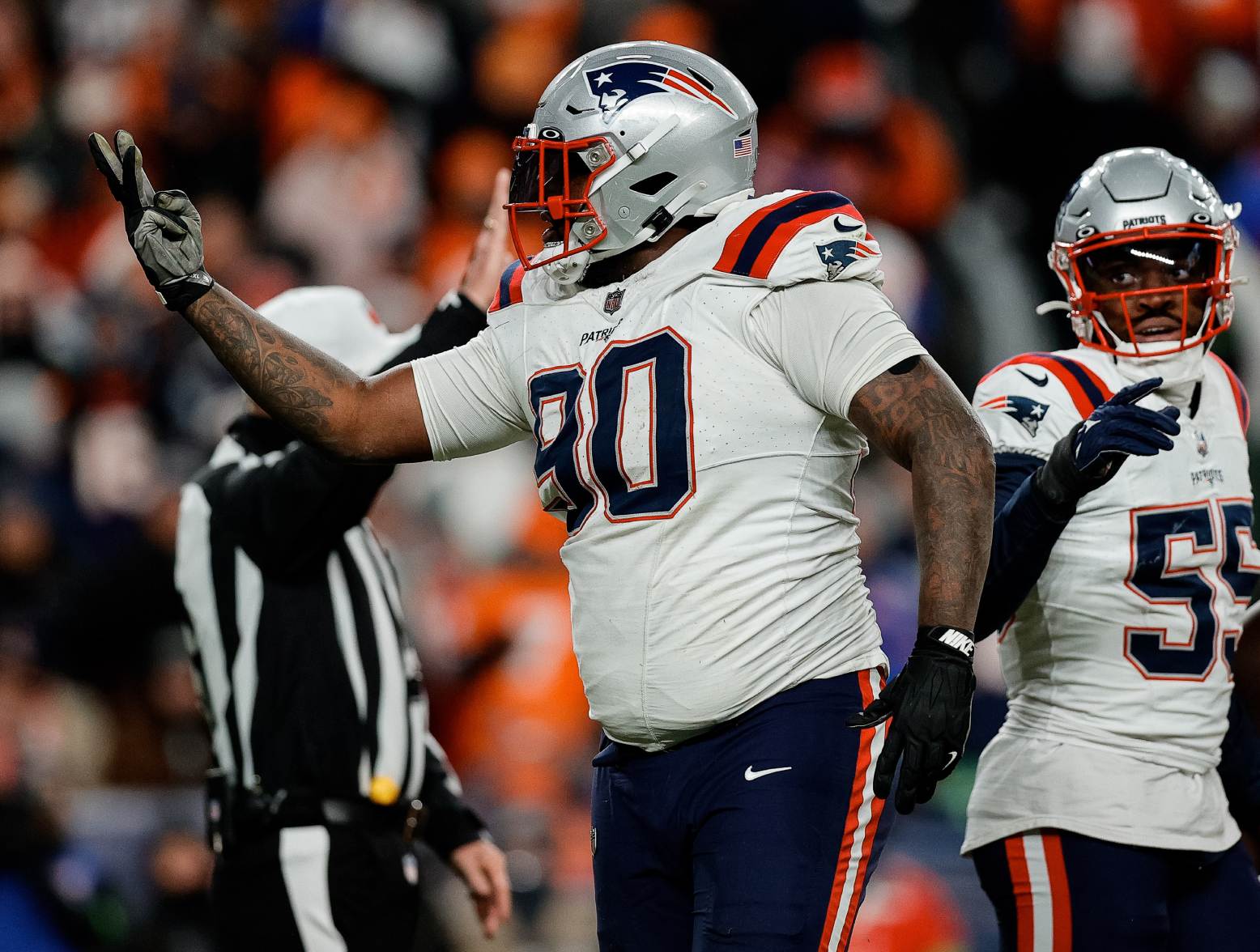 Dec 24, 2023; Denver, Colorado, USA; New England Patriots defensive tackle Christian Barmore (90) reacts after a play ]in the third quarter against the Denver Broncos at Empower Field at Mile High. Credit: Isaiah J. Downing-USA TODAY Sports