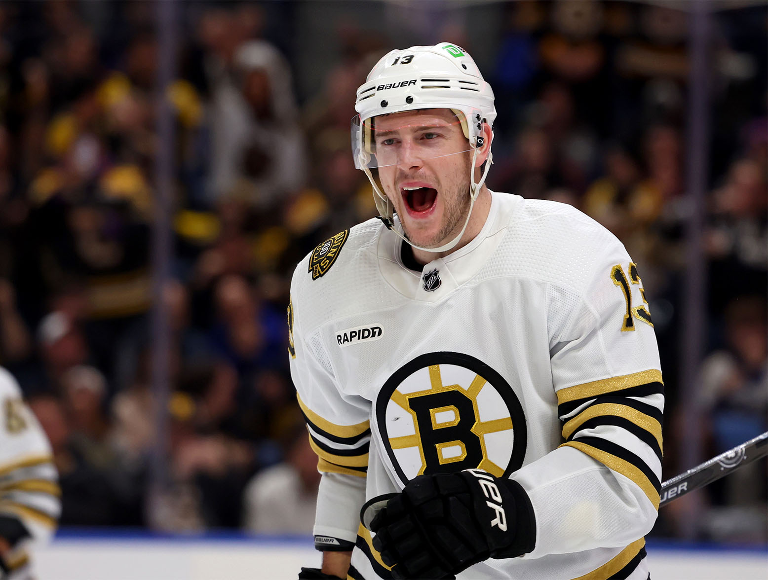 Dec 27, 2023; Buffalo, New York, USA; Boston Bruins center Charlie Coyle (13) reacts after scoring a goal during the first period against the Buffalo Sabres at KeyBank Center. Mandatory Credit: Timothy T. Ludwig-USA TODAY Sports