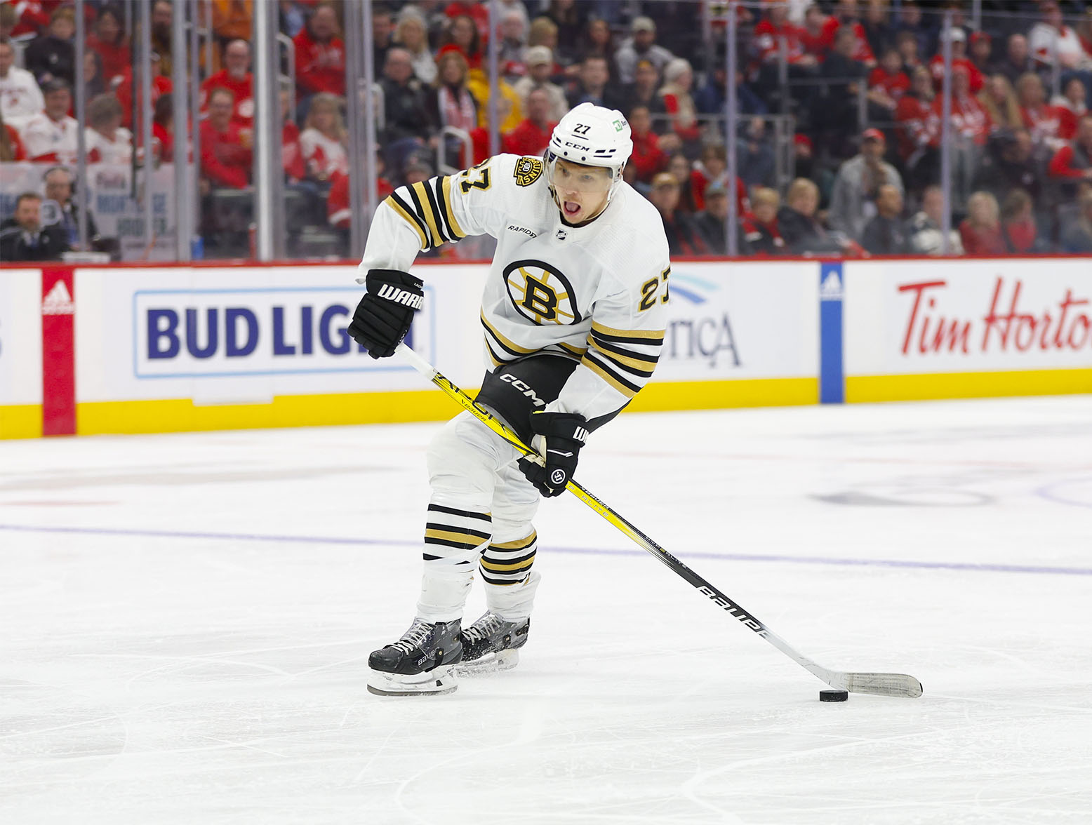 Dec 31, 2023; Detroit, Michigan, USA; Boston Bruins defenseman Hampus Lindholm (27) handles the puck during the first period of the game between the Boston Bruins and the Detroit Red Wings at Little Caesars Arena. Mandatory Credit: Brian Bradshaw Sevald-USA TODAY Sports