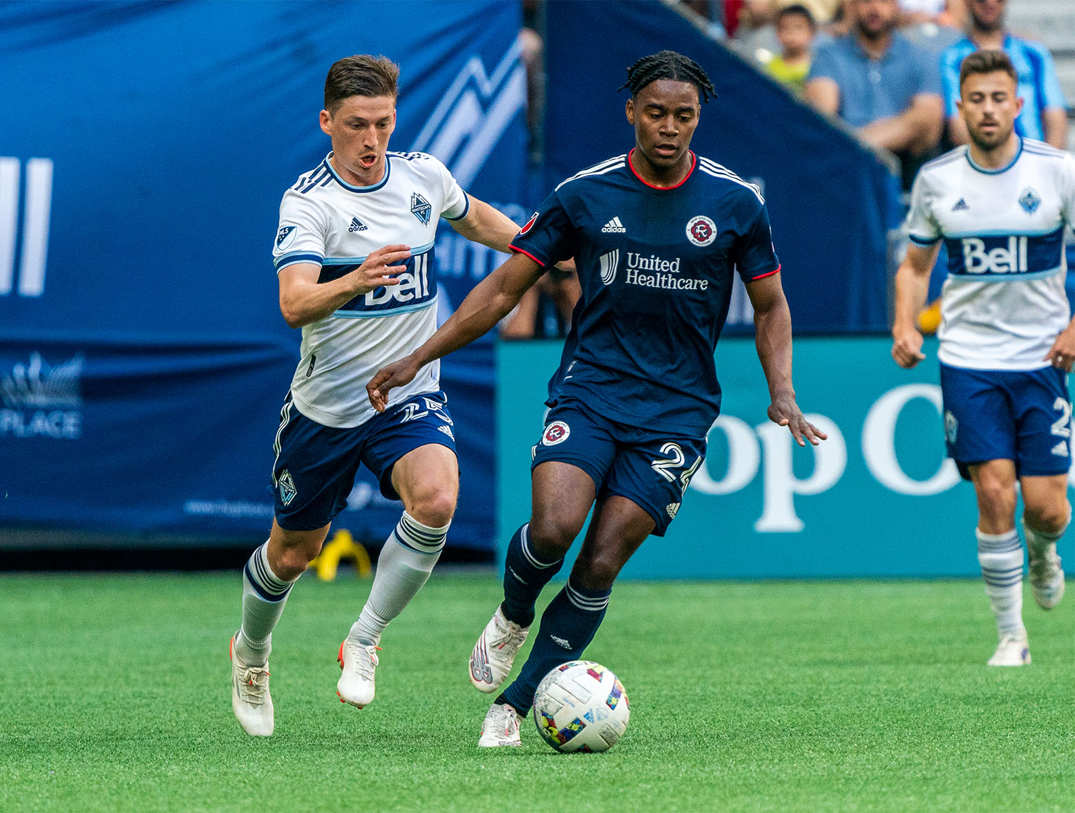 VANCOUVER, BC - JUNE 26: DeJuan Jones #24 of the New England Revolution breaks away during the game between Vancouver Whitecaps and the New England Revolution at BC Place on June 26, 2022 in Vancouver, British Columbia. (Photo by Jordan Jones/Getty Images)