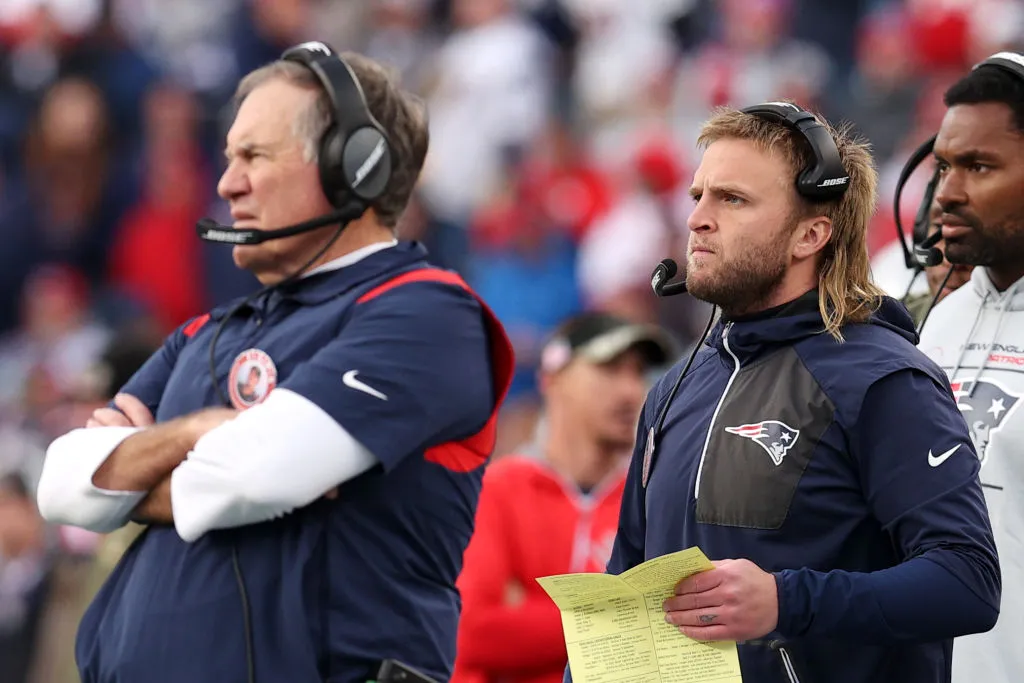 FOXBOROUGH, MASSACHUSETTS - NOVEMBER 14: New England Patriots head coach Bill Belichick stands with linebackers coach Steve Belichick on the sideline at Gillette Stadium on November 14, 2021 in Foxborough, Massachusetts. (Photo by Maddie Meyer/Getty Images)