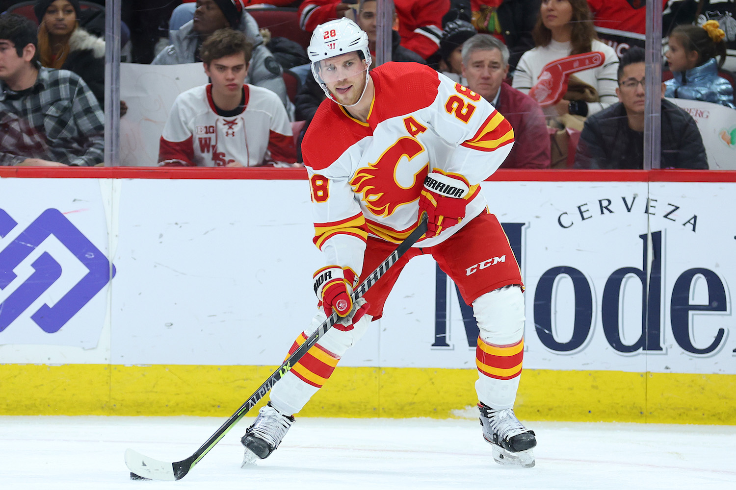 CHICAGO, ILLINOIS - JANUARY 08: Elias Lindholm #28 of the Calgary Flames skates with the puck against the Chicago Blackhawks at United Center on January 08, 2023 in Chicago, Illinois. (Photo by Michael Reaves/Getty Images)