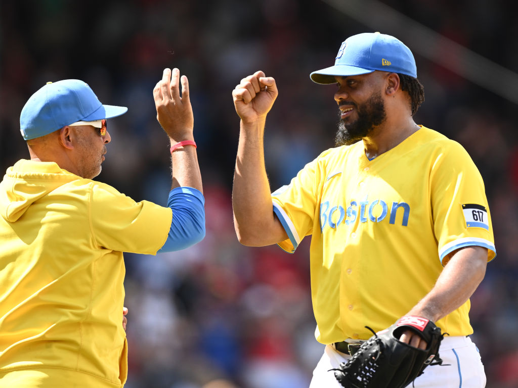 BOSTON, MASSACHUSETTS - AUGUST 13: Kenley Jansen #74 of the Boston Red Sox high-fives manager Alex Cora after a game against the Detroit Tigers at Fenway Park on August 13, 2023 in Boston, Massachusetts. (Photo by Brian Fluharty/Getty Images)