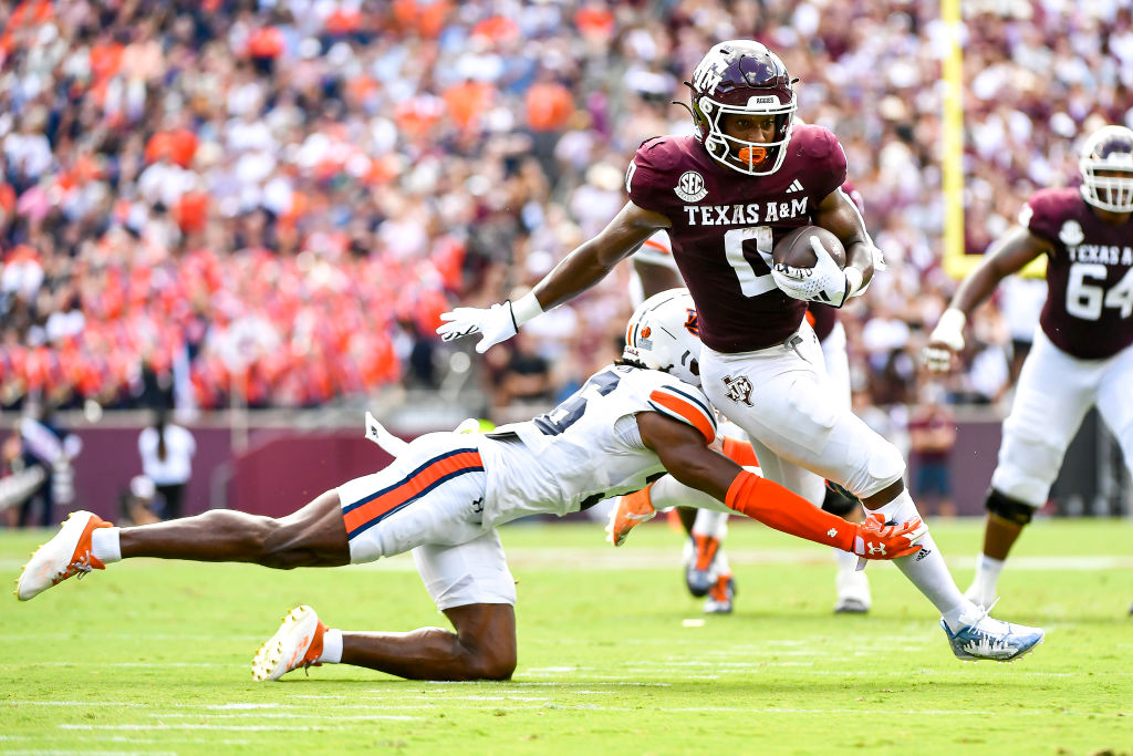 COLLEGE STATION, TEXAS - SEPTEMBER 23: Wide receiver Ainias Smith #0 of the Texas A&M Aggies breaks a tackle in the first quarter against the Auburn Tigers at Kyle Field on September 23, 2023 in College Station, Texas. (Photo by Logan Riely/Getty Images)